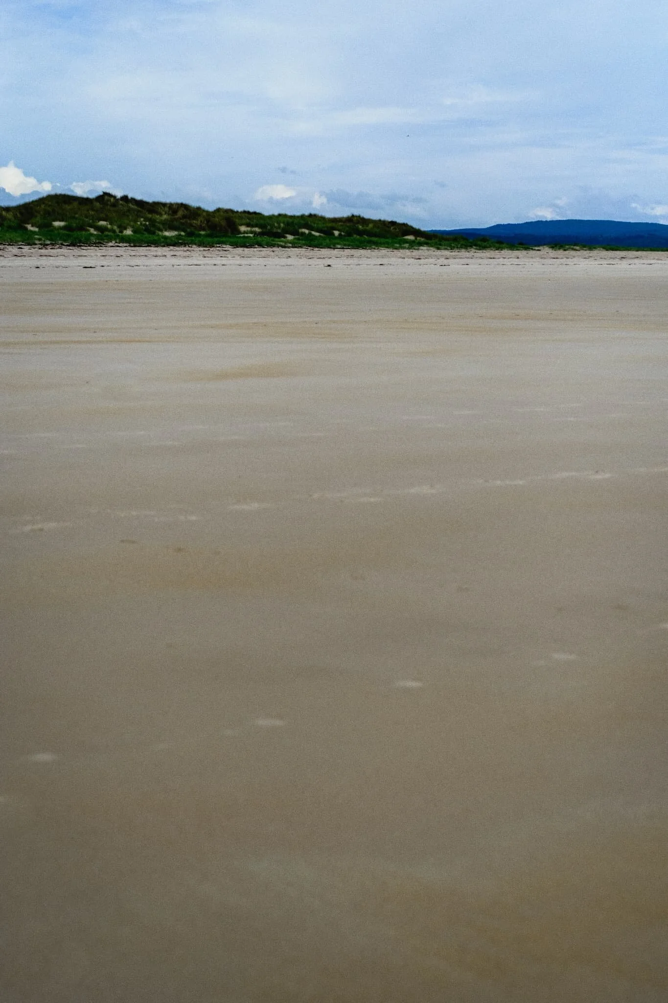 A minimalistic composition involving the vast virgin sands of Budle Bay.
