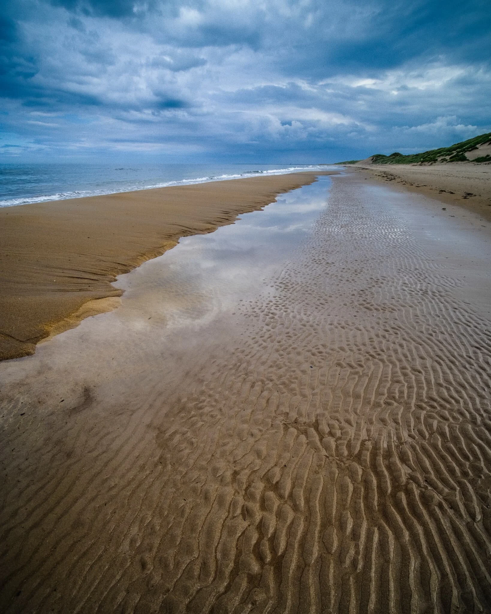 Miles of rippled wet sand and a long pool reflecting the dramatic sky above. What a quality day.