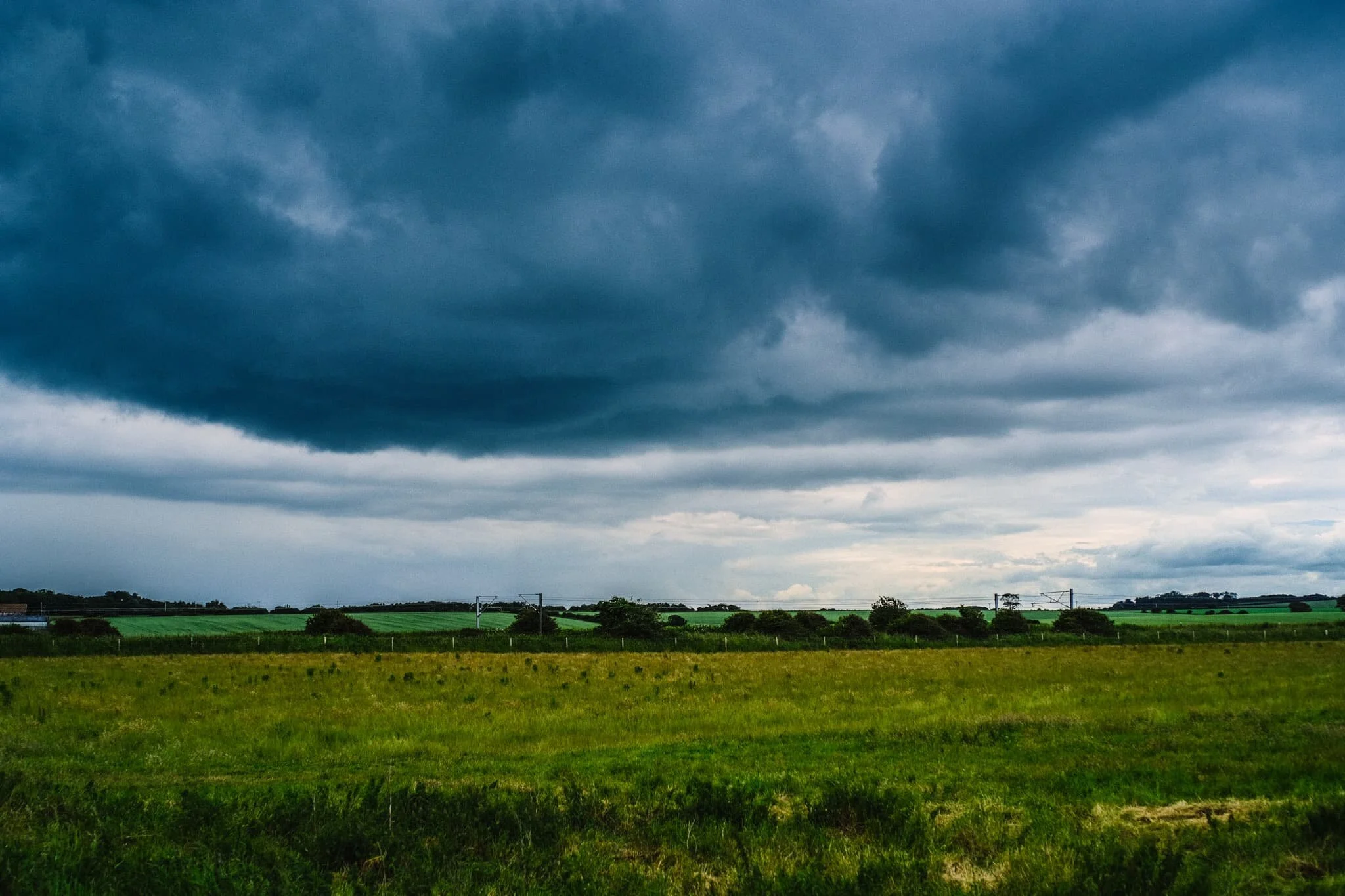 After escaping the rains falling over Bamburgh and inland Northumberland, we drove north to visit a relatively little-known beach called Cheswick Sands. I snapped the rather dramatic skyline from the car park. Good job we weren’t under that.