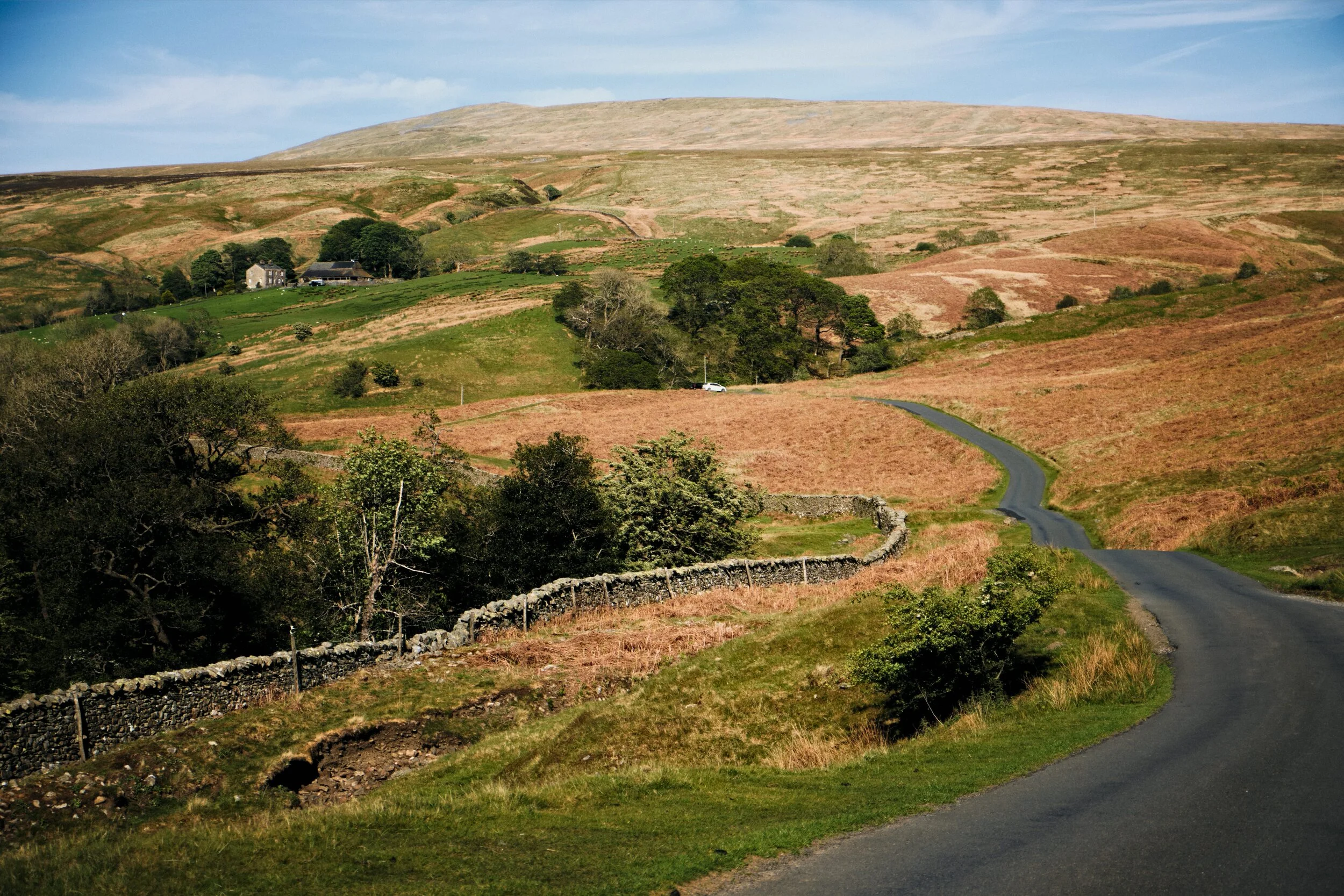 Looking back along the road to Crag Hill and Fell House farm underneath.