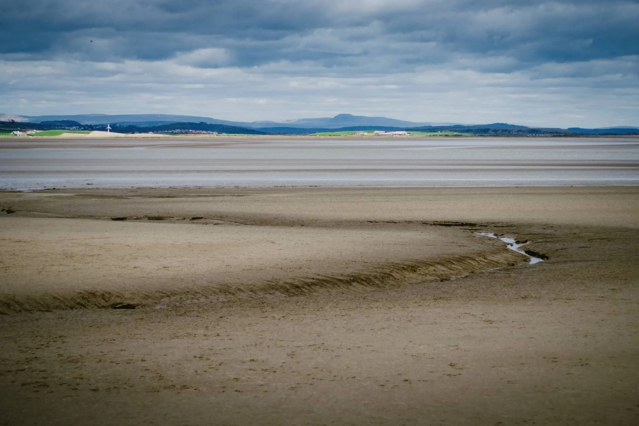 When the tide is out, one can follow the many channels cut into the Levens Estuary.