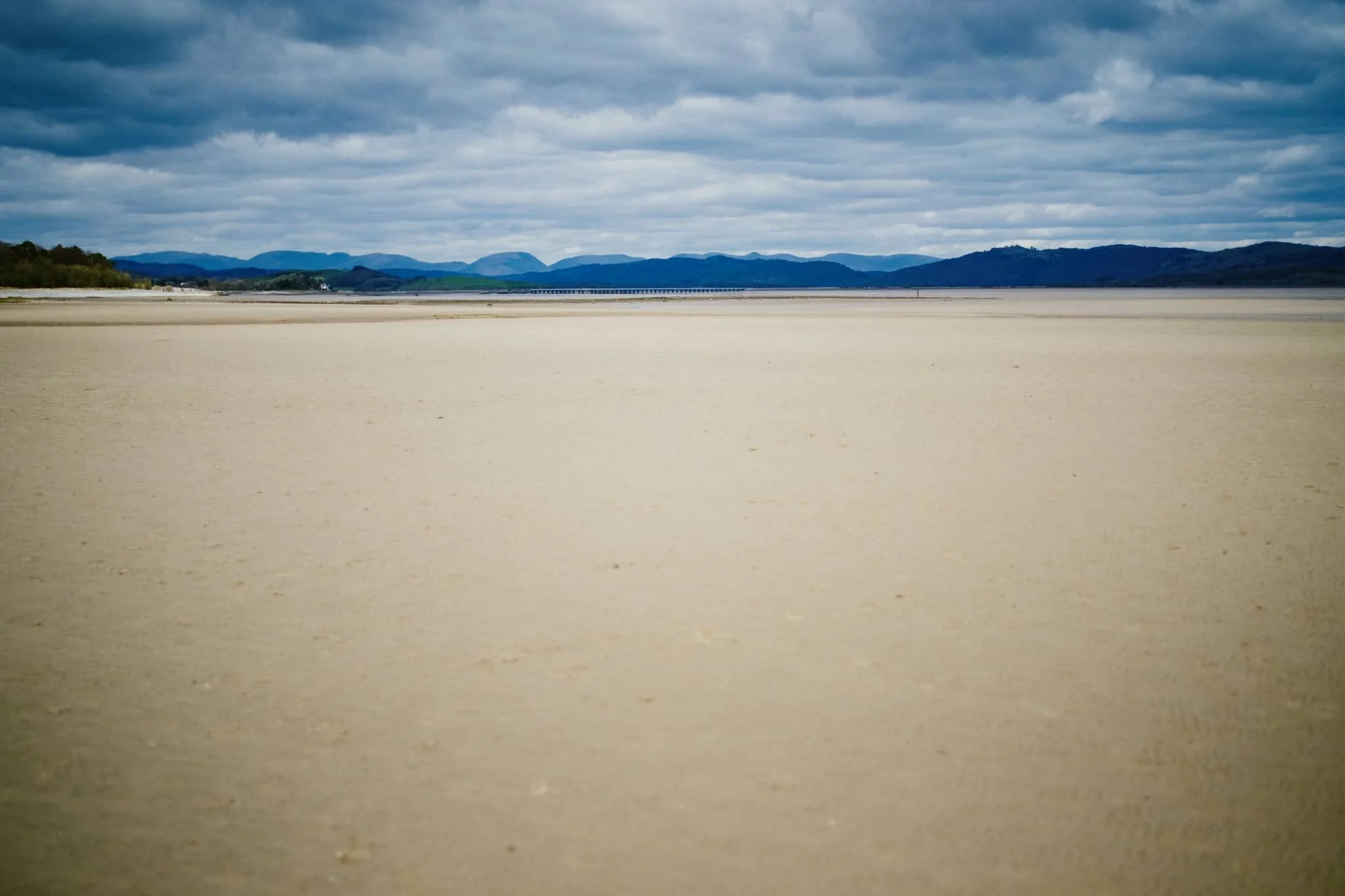 The Southern Fells of the Lake District and the endless expanse of sand at the Levens Estuary.