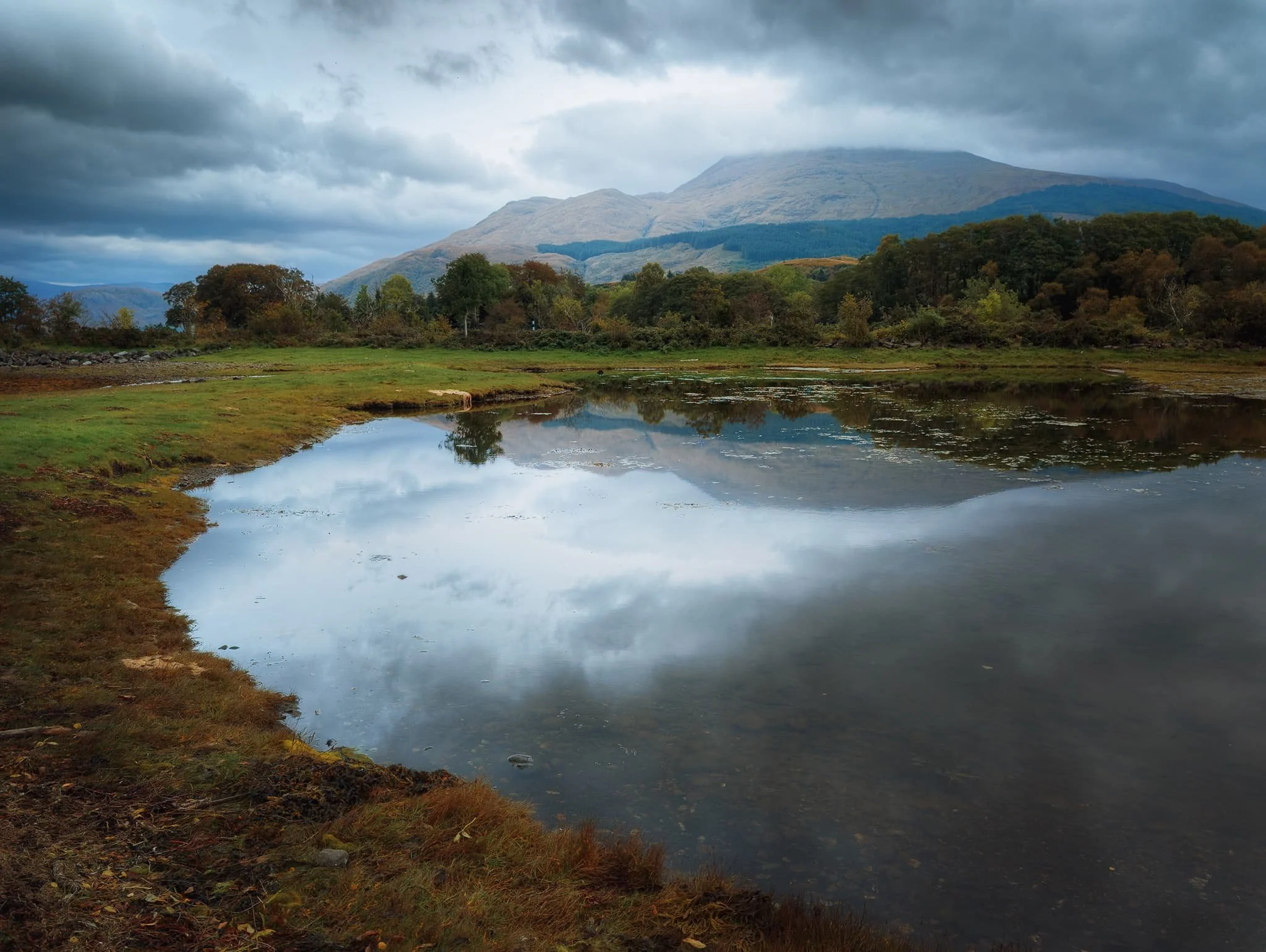  North from the historical ruins we made our way towards the southern shore of Loch Etive. On the way, a small pond gave beautiful reflections of the massive  Ben Cruachan  in the distance. 