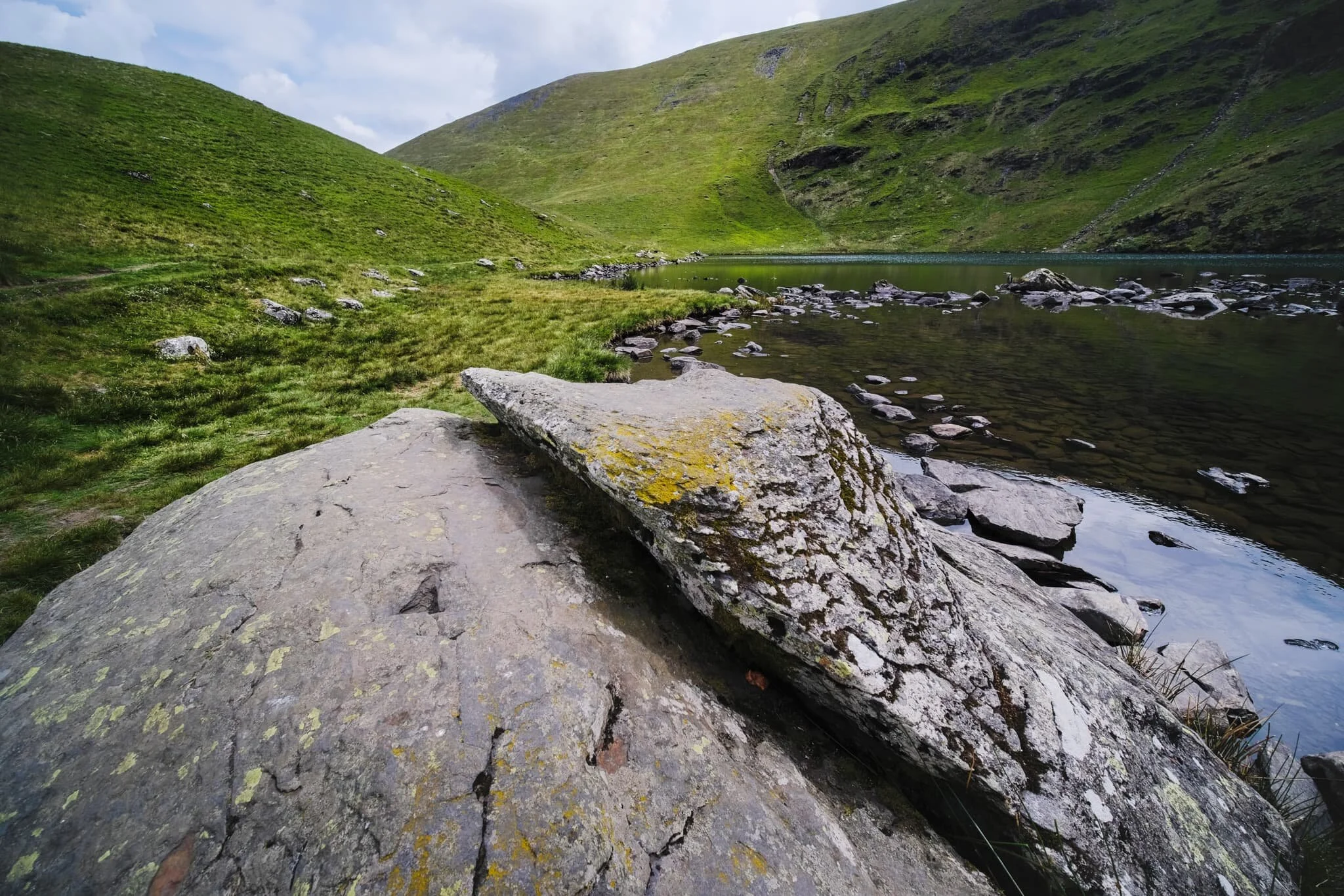 Near the outflow of the tarn, which drops to the valley floor as Tarn Sikes, one can find some impressive boulders offering compositional interest.