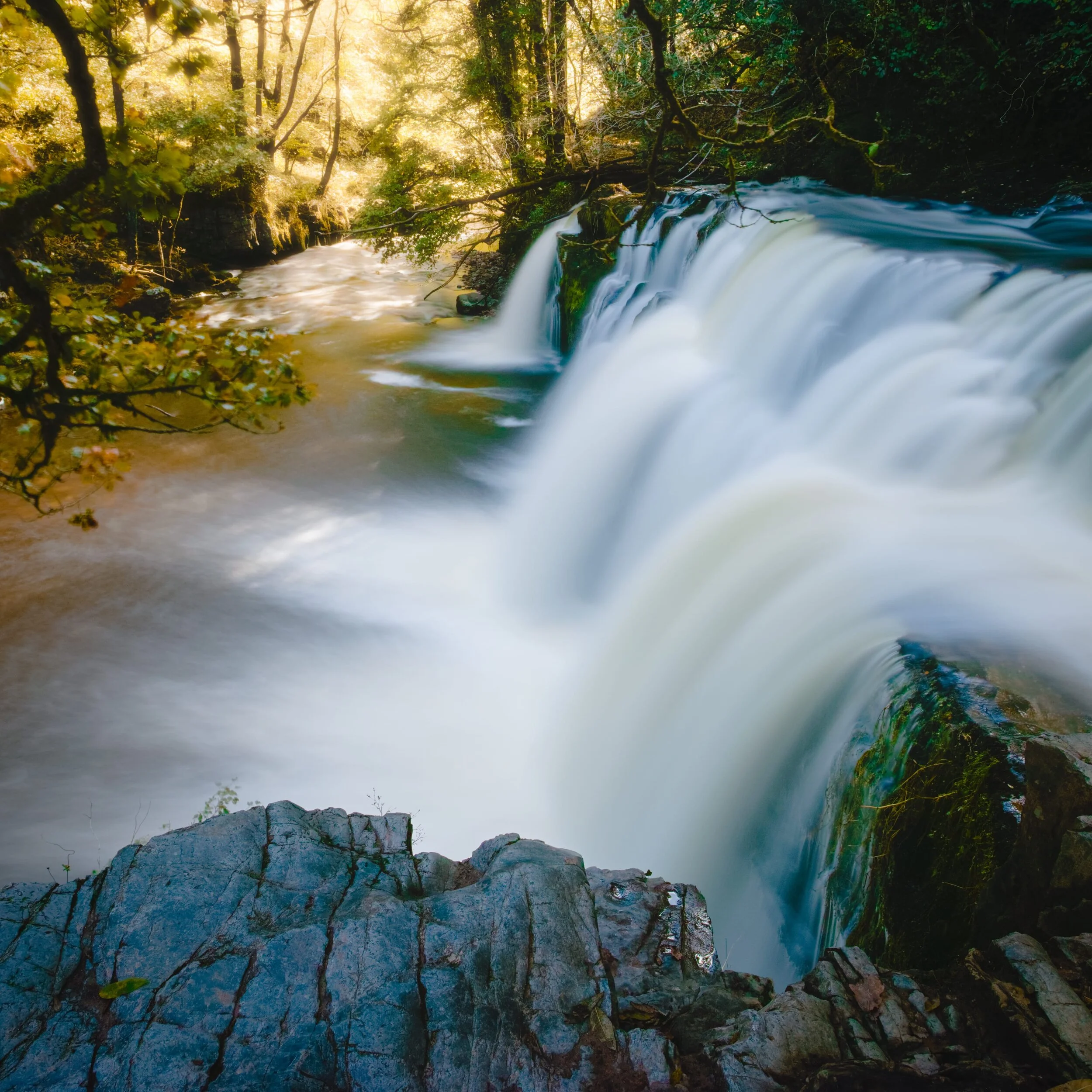  Sgwd y Pannwr (&ldquo;SGOOD ee pann-ooer&rdquo;, meaning &ldquo;Falls of the Fuller&rdquo;), which we were able to get right next to after a particularly gruelling hike down the ravine. The roar and sheer power of the water… 