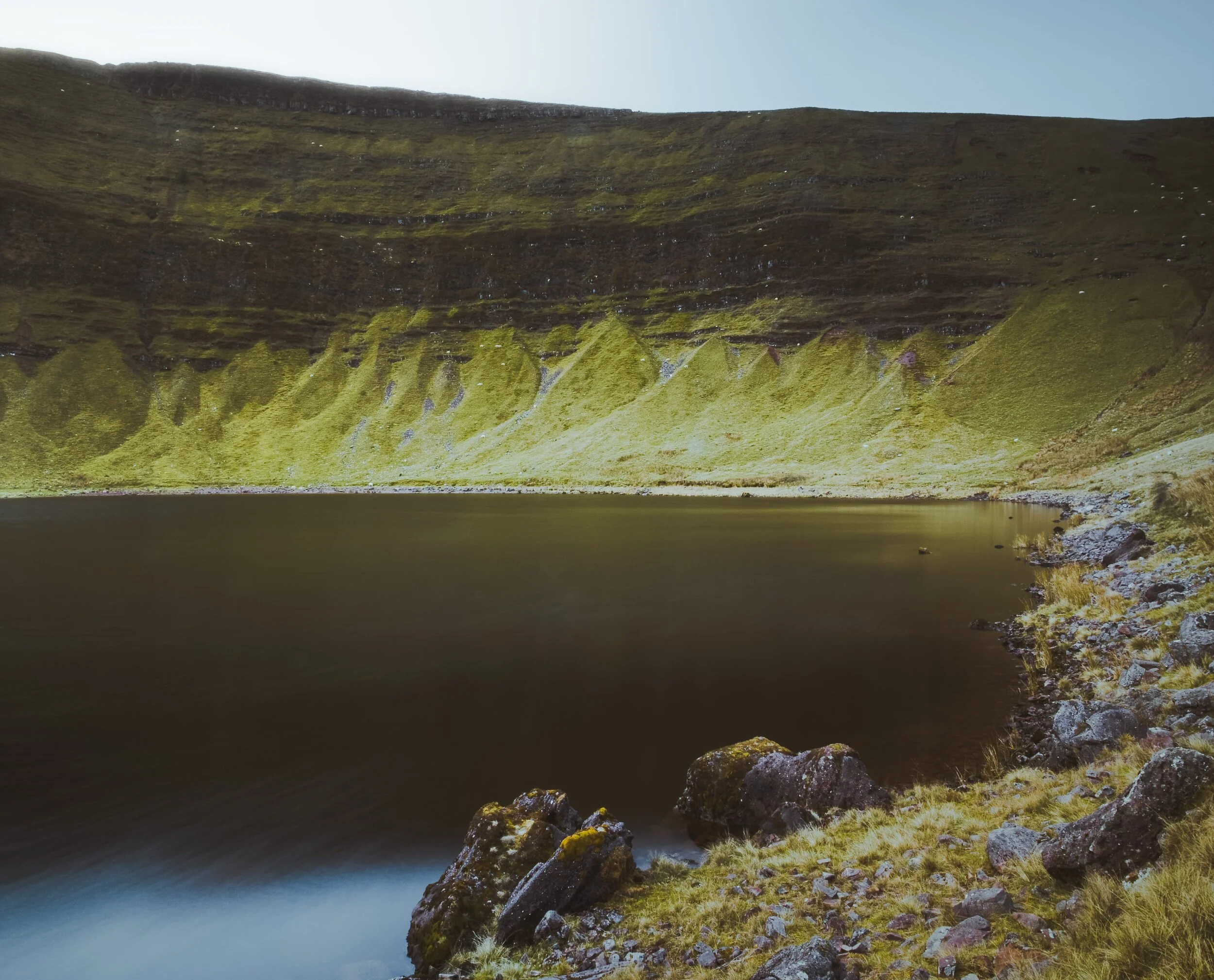  A composition towards Llyn y Fan Fach&rsquo;s west end, showing the sheer wall of the Carmarthen Fans. 
