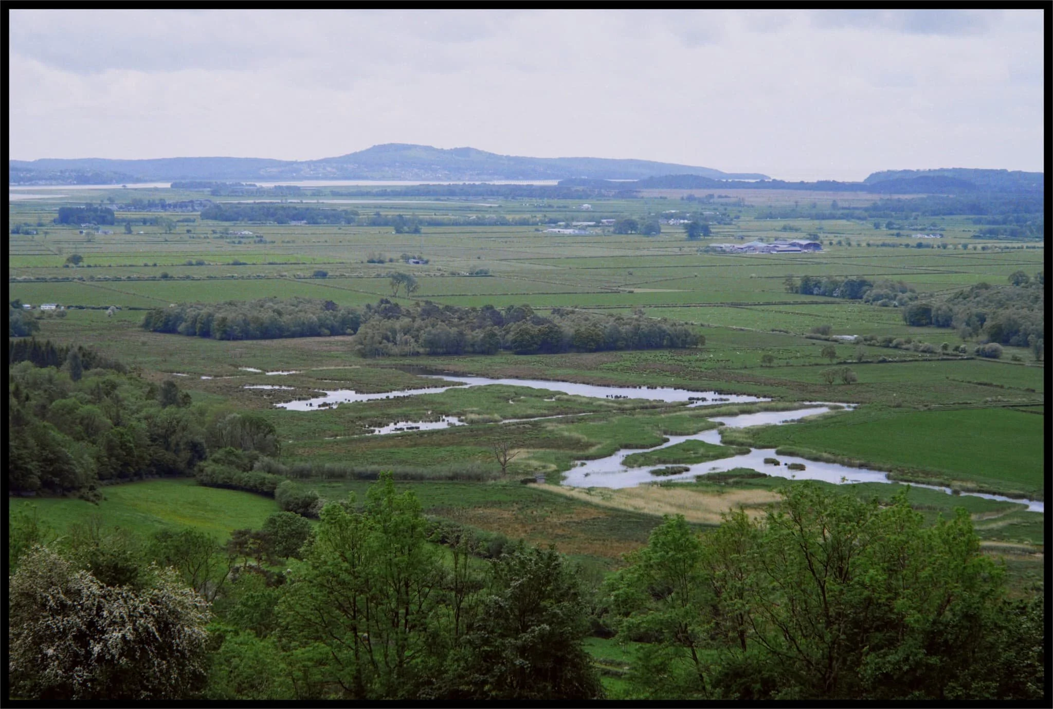  As we started climbing the road up back towards St. John&rsquo;s Church, the views opened to us again. Here you can see right across the Lyth Valley and even the Kent Estuary towards  Arnside Knott . 