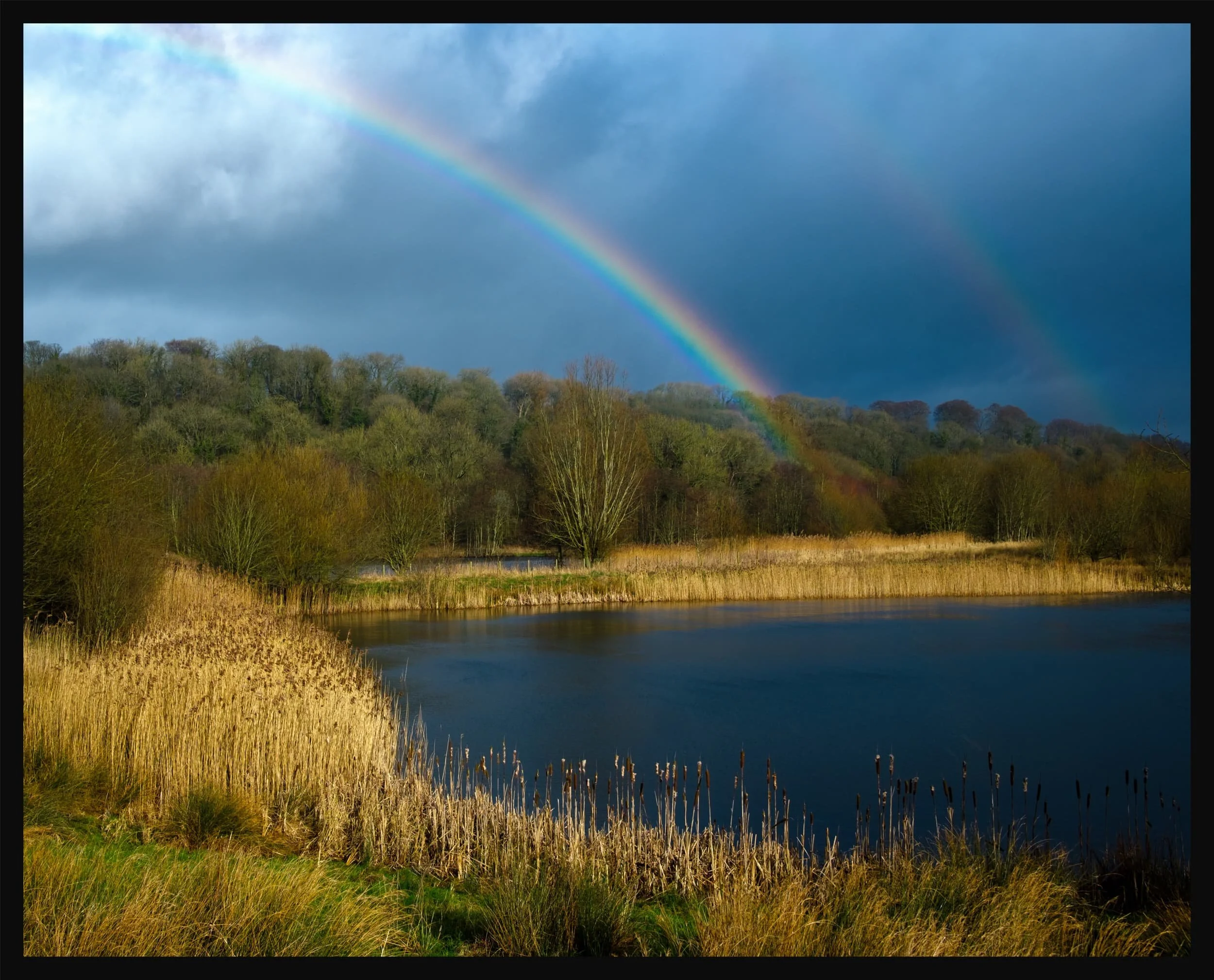  Thankfully, the unsettled conditions resulted in this wonderfully clear double rainbow arching over the ponds. 