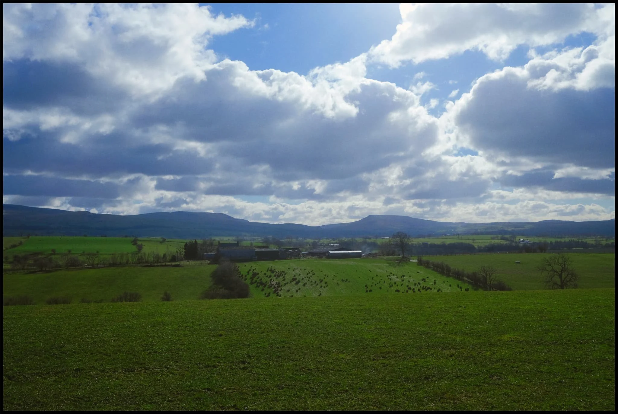  Looking south across the fields to the Mallerstang valley, flanked by Wild Boar Fell and Mallerstang Edge. 
