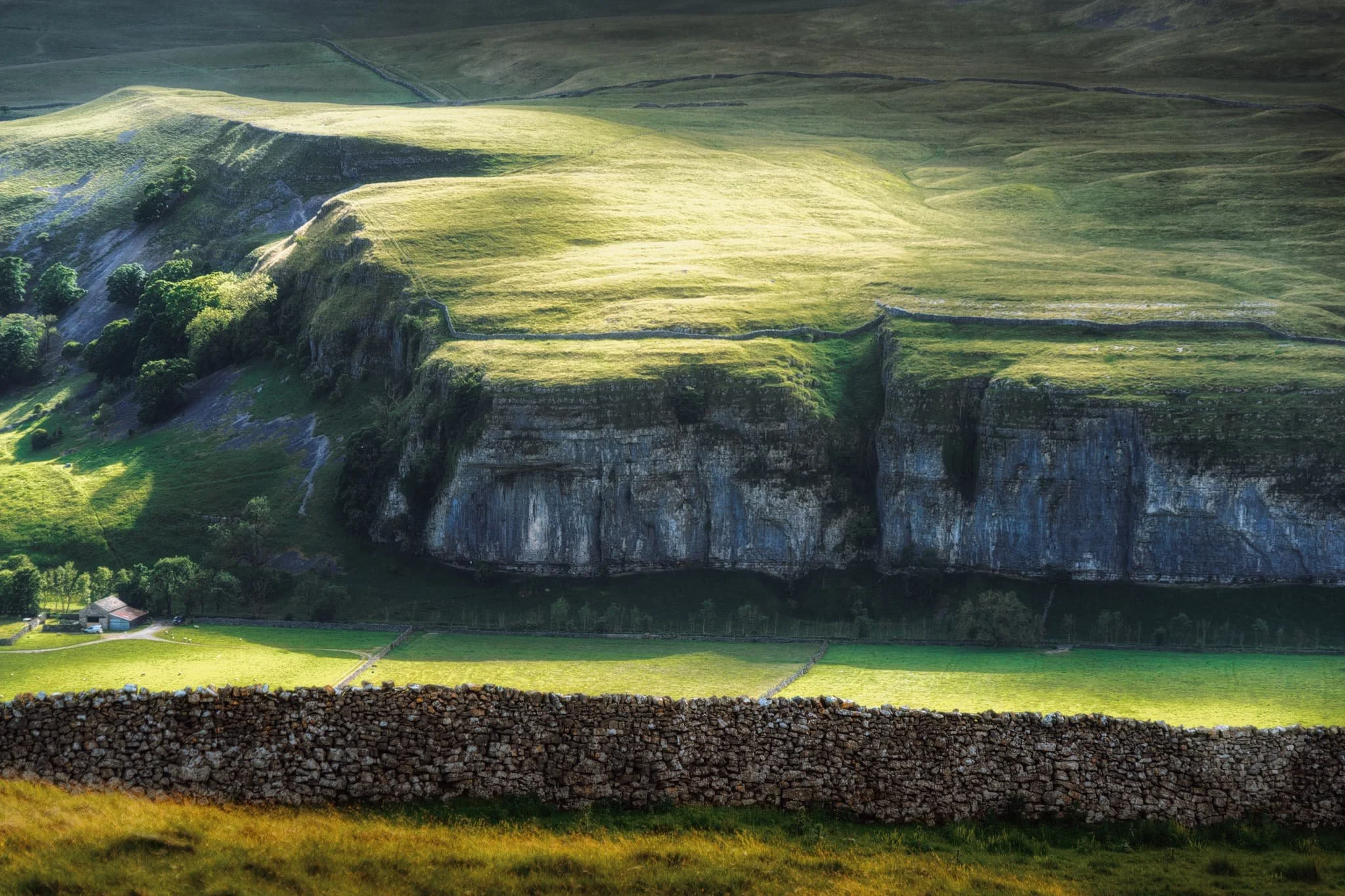  From the top of the Pie you can even make out, across the valley, the impressive sheer face of Kilnsey Crag, a famous and challenging climb. 