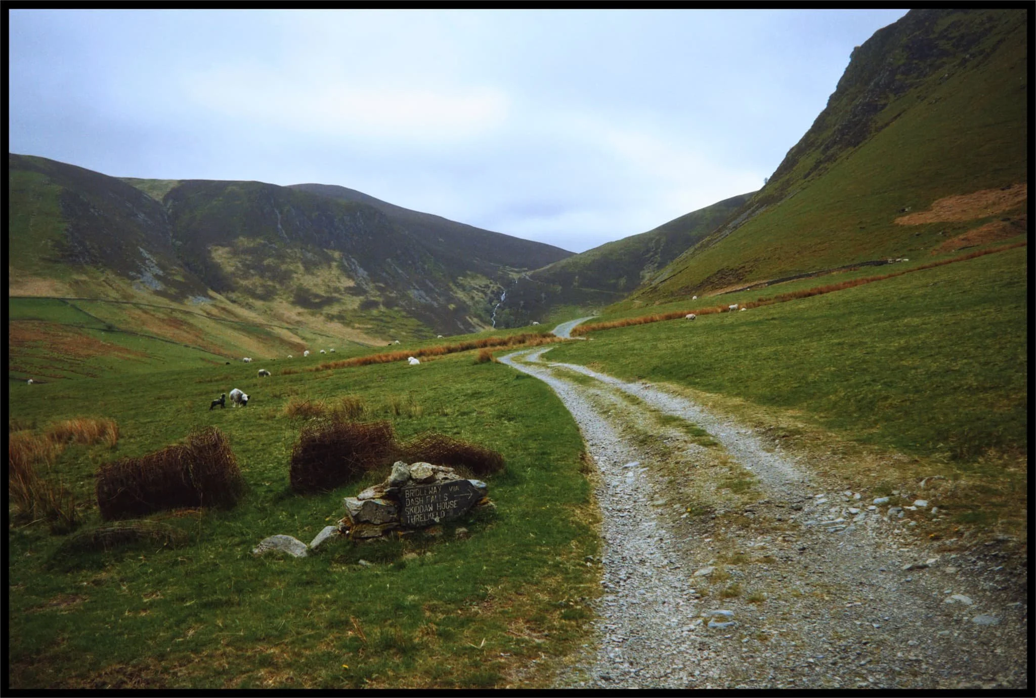  A marker stone indicates the bridleway ahead towards Dash Falls. Beyond the falls you can carry on over via the Cumbria Way towards Skiddaw House, a hostel in the middle of Skiddaw Forest. 