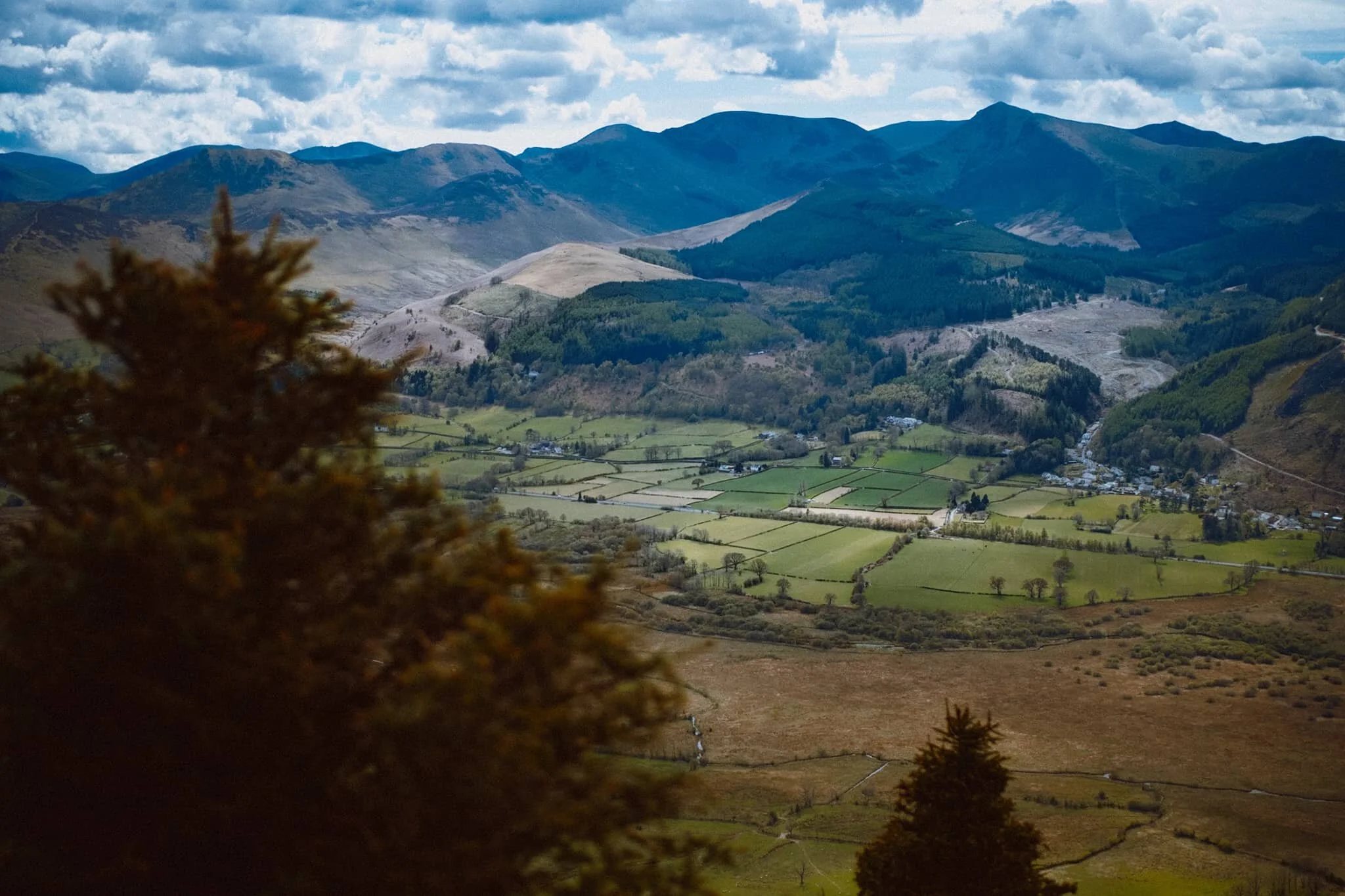The Lorton Fells and Grisedale Pike. Little hovering spots of light scan across the land.