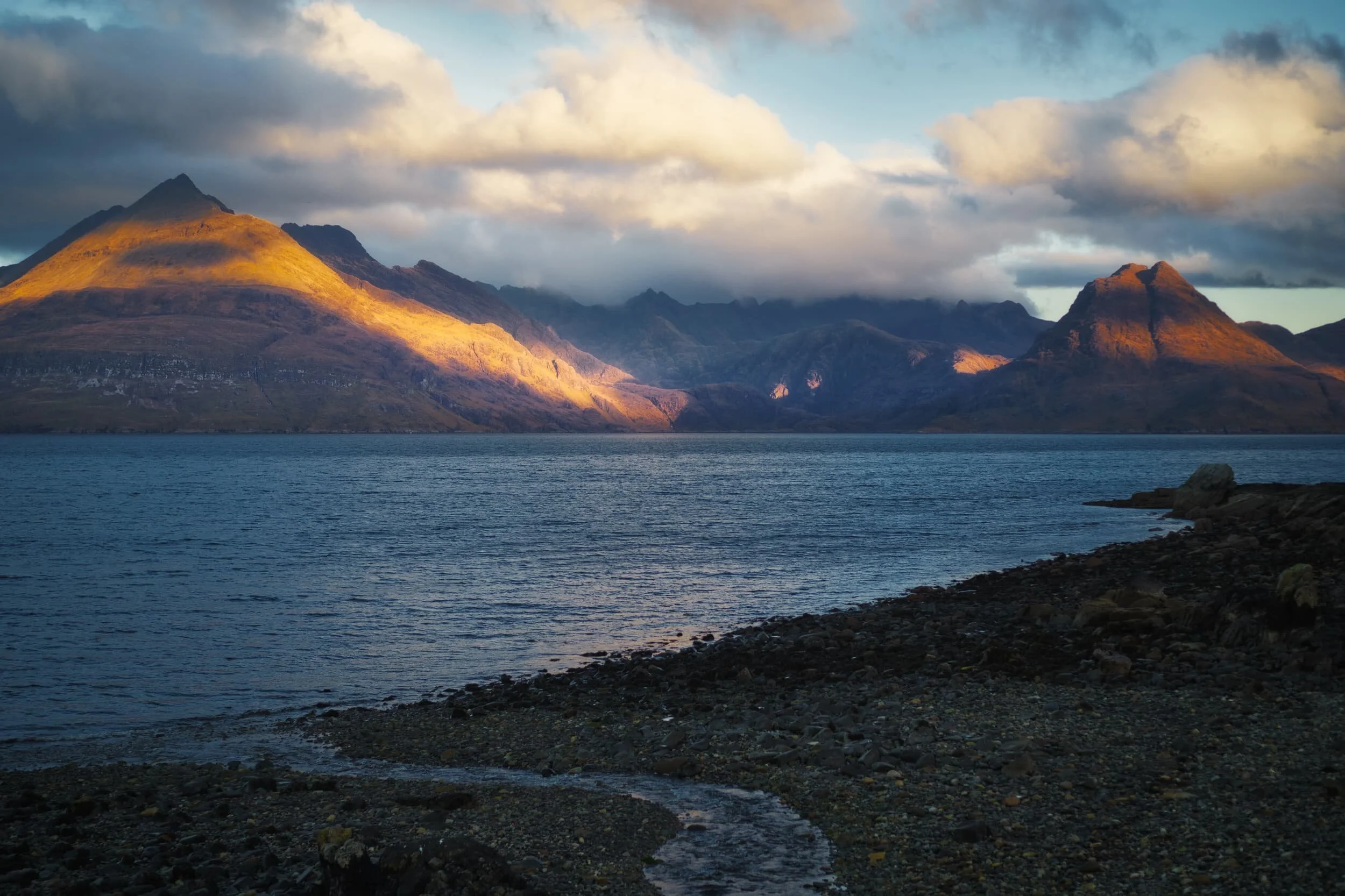   This  is the view one is treated to as you arrive at the main car park near the shore of Elgol. It&rsquo;s just ridiculously stunning. As the sun was rising behind us it cast slivers of golden light, which caressed the Black Cuillins in a dazzling display. 
