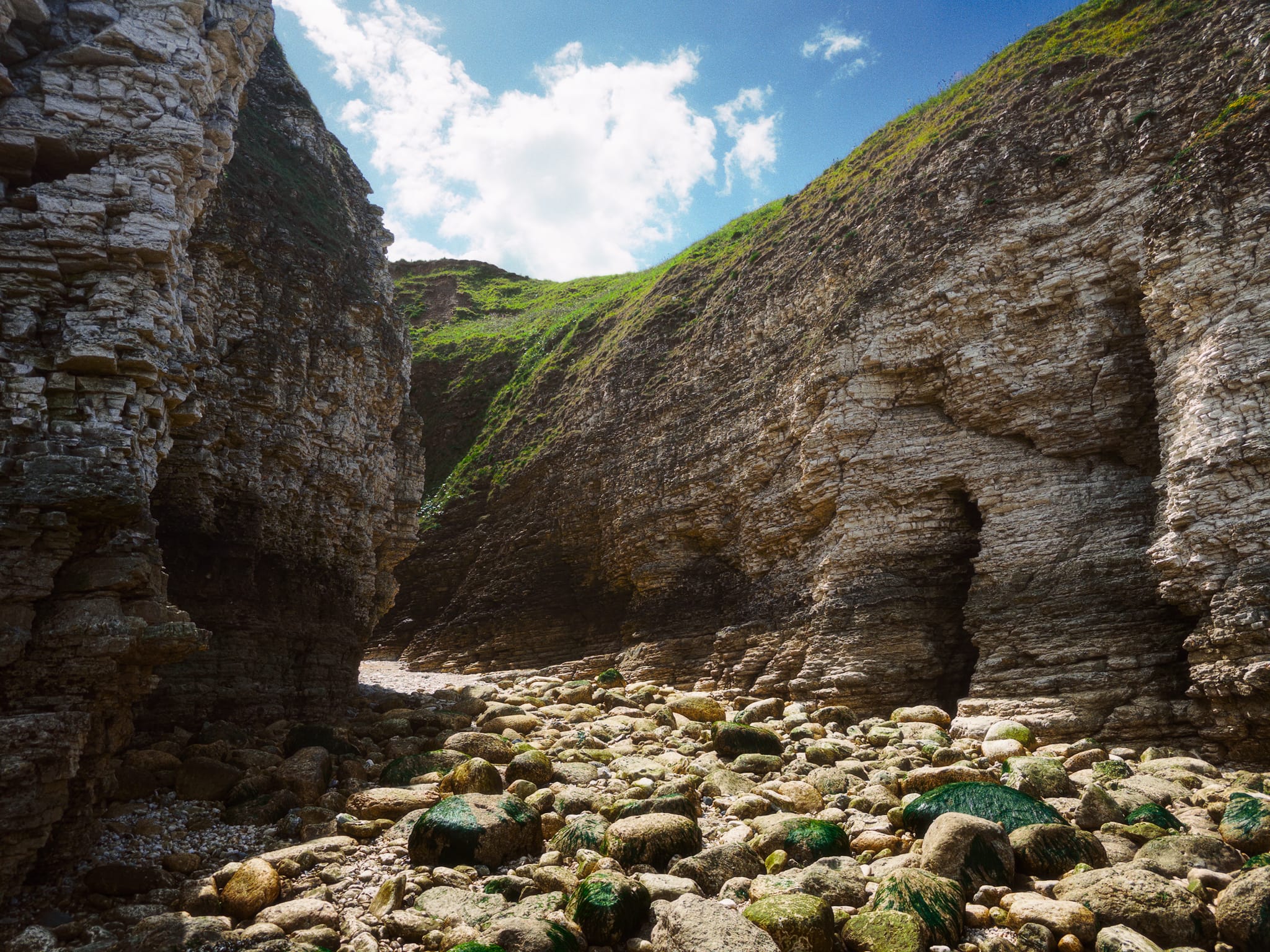 Some of the North Sea&rsquo;s work is so great that mini gorges have been gouged out of the coastline, like this one. 