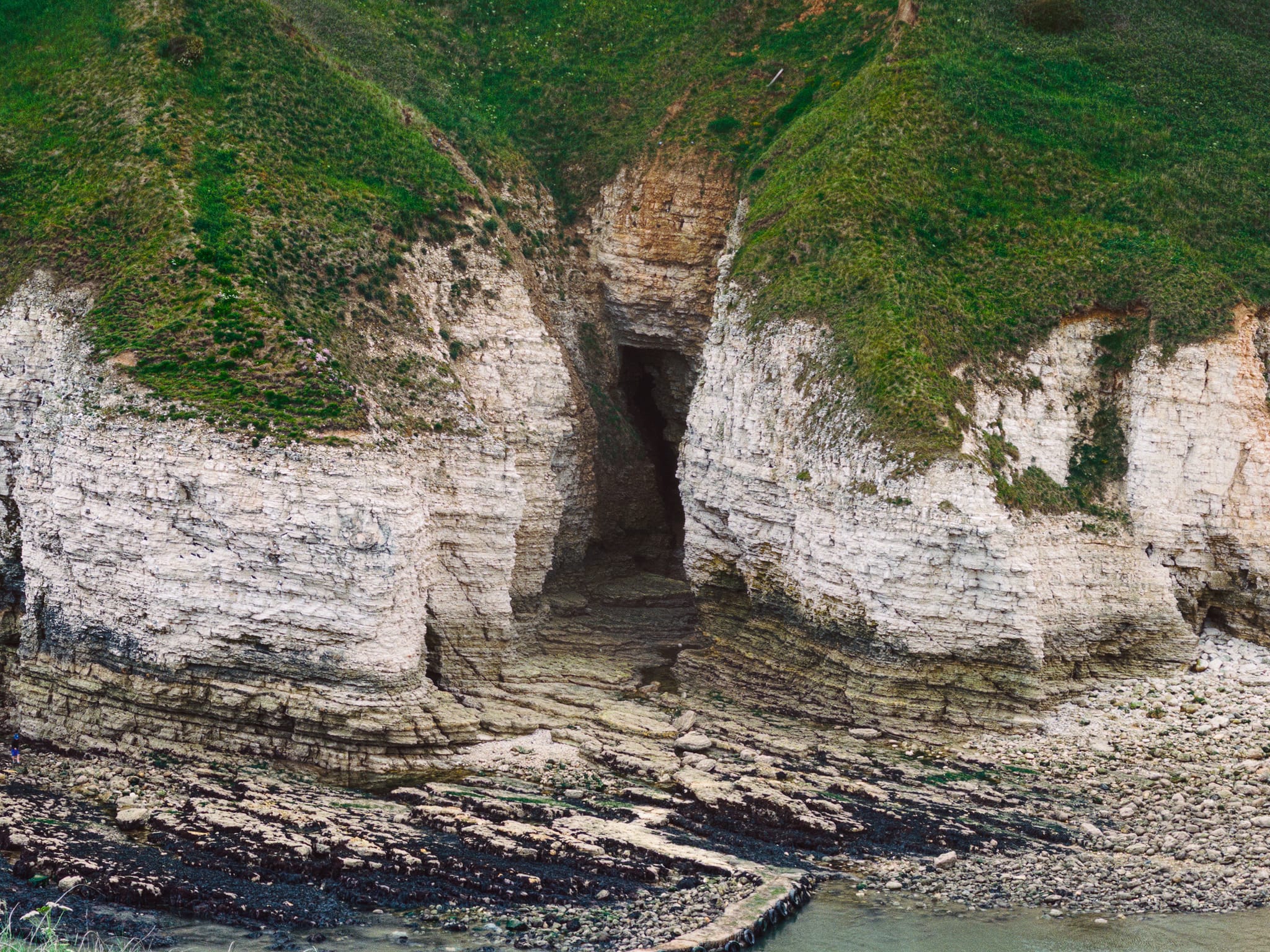 A particularly deep cave from the top of the cliffs. I wasn&rsquo;t brave enough to wander into this one.