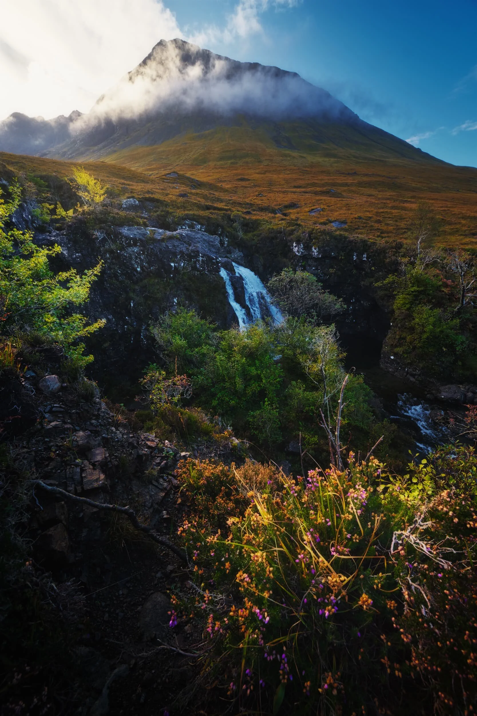  As we hiked further up the path the hill fog started to burn off, revealing some of the tops of the Black Cuillins. This peak in particular is  Sgùrr Thuilm  (meaning &ldquo;Rocky peak of the hillock&rdquo;) and measures 881 m/2,890 ft high. 