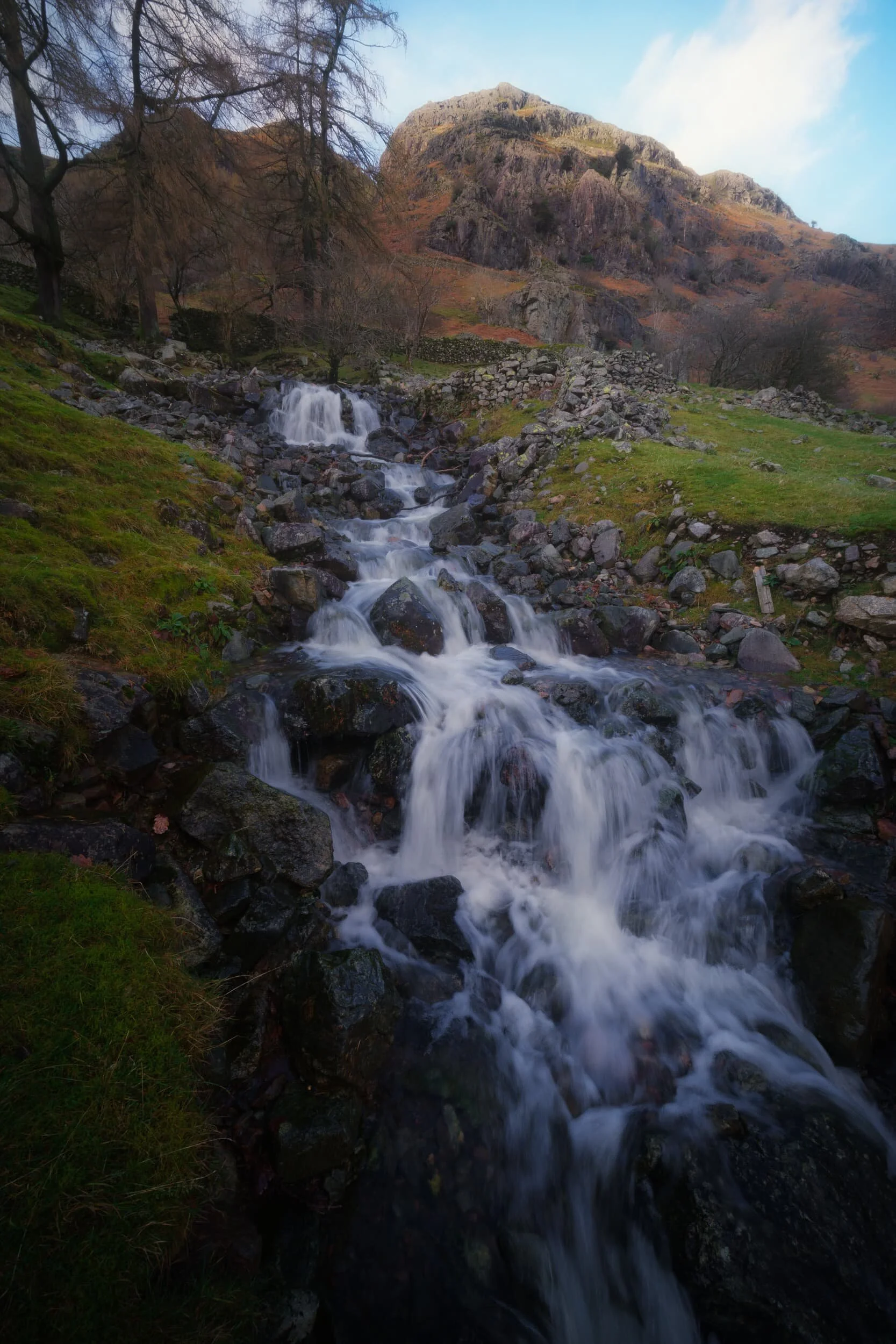 Here’s something I didn’t know about in Great Langdale! Near the Stickle Ghyll Barn Dad and I spotted a small stile that allowed one access over the fence towards these wonderful cascades. I whipped out my 9mm ultra-wide lens for some compositions of these cascades and Whitegill Crag above.