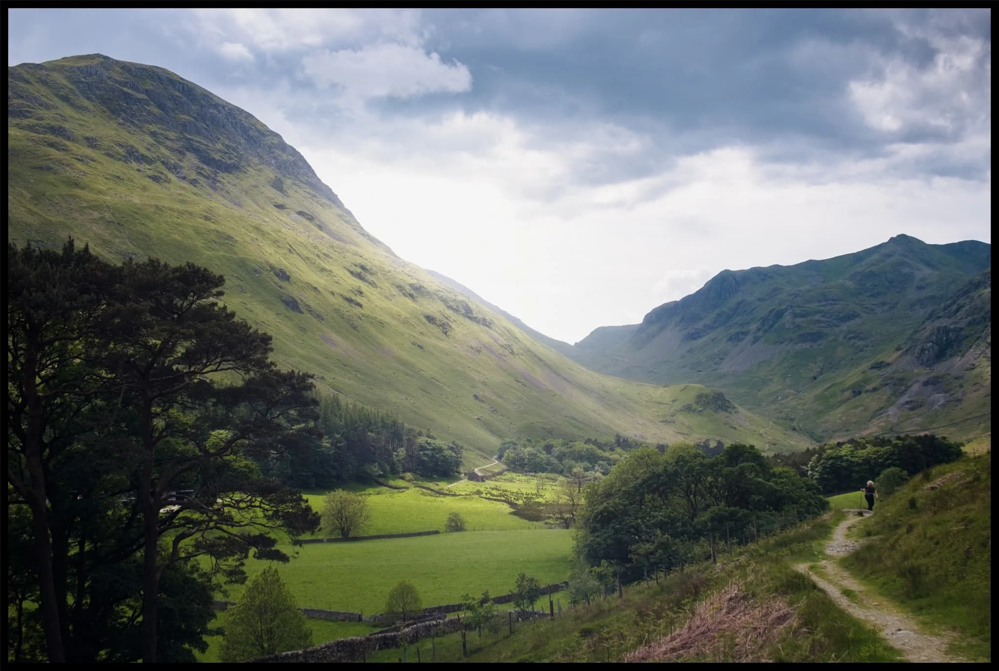  One last look back at Grisedale, now with more cloud cover making the sun beam shafts of light on the landscape. St. Sunday Crag to the left, Dollwaggon Pike and Nethermost Pike on the right. 