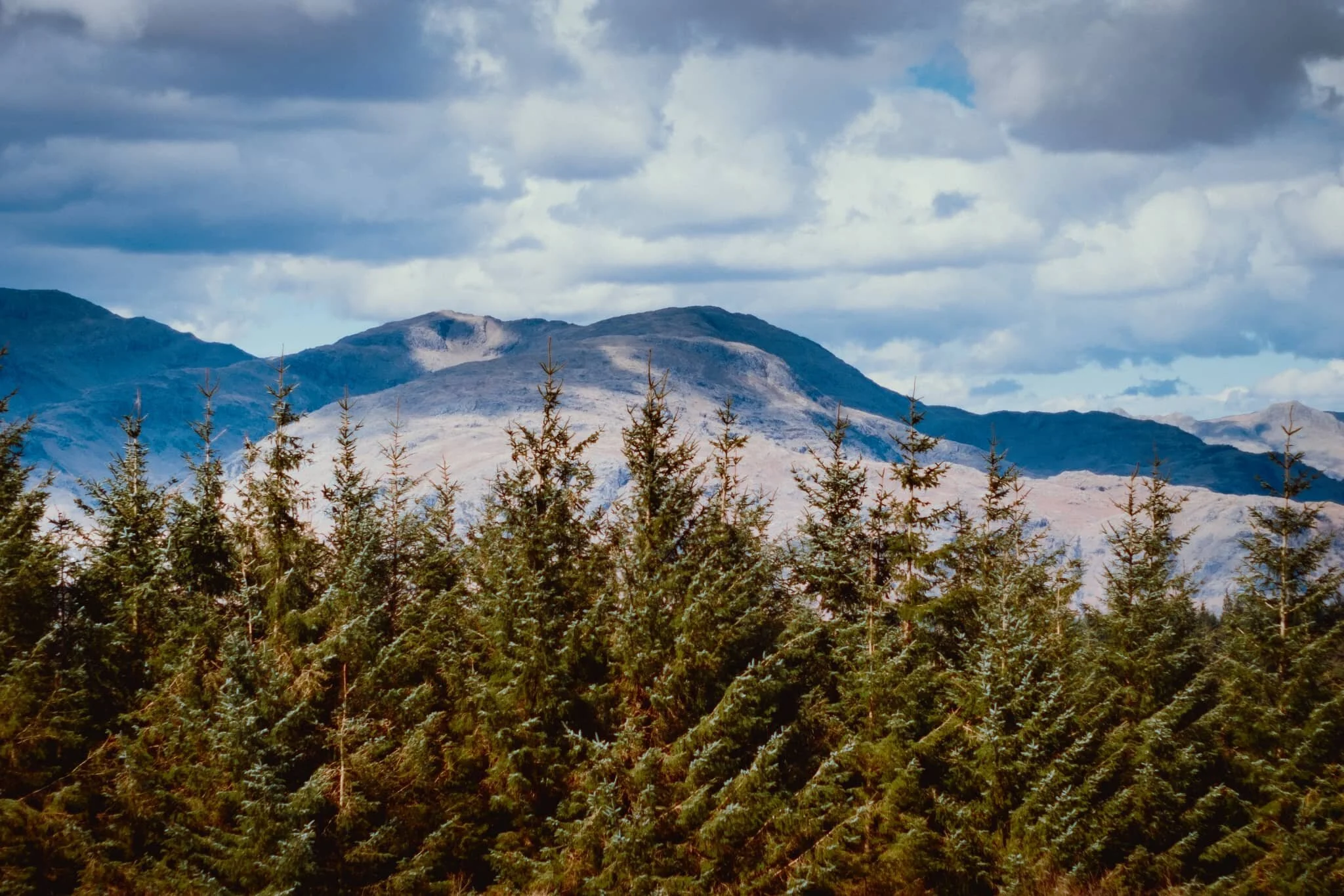 More of the Coniston fells, catching some dappled light through the increasing cloud cover.