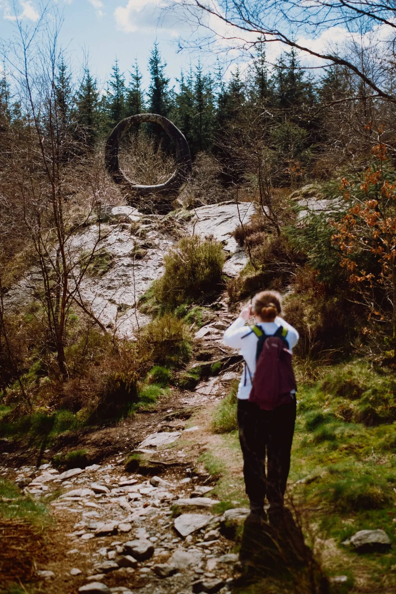 Coming down the other side of the summit, Lisabet finds one of many sculptures dotted about the forest.
