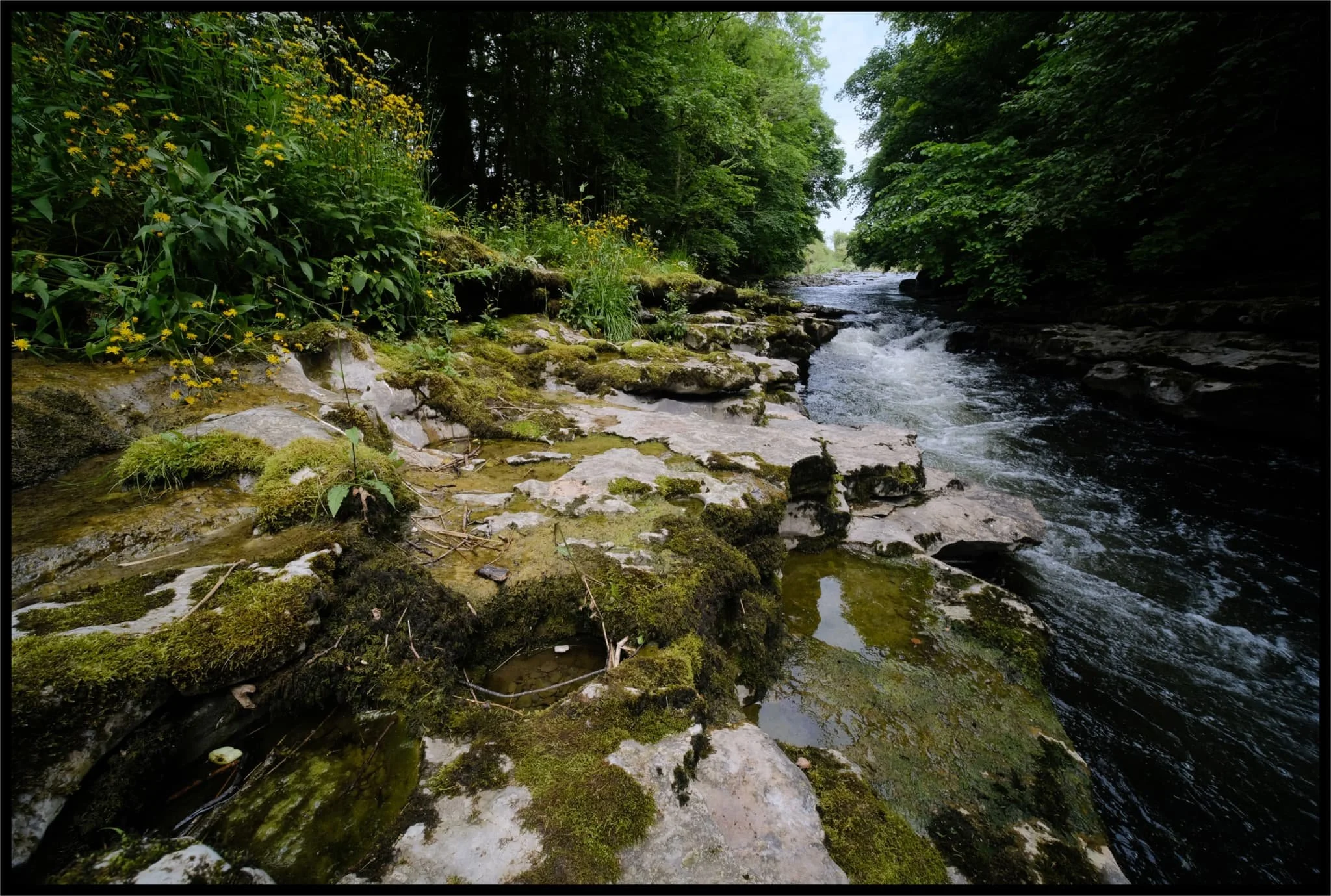  On goes the ultra-wide lens to really feature some of the shapes in the limestone carved by the waterfall. 