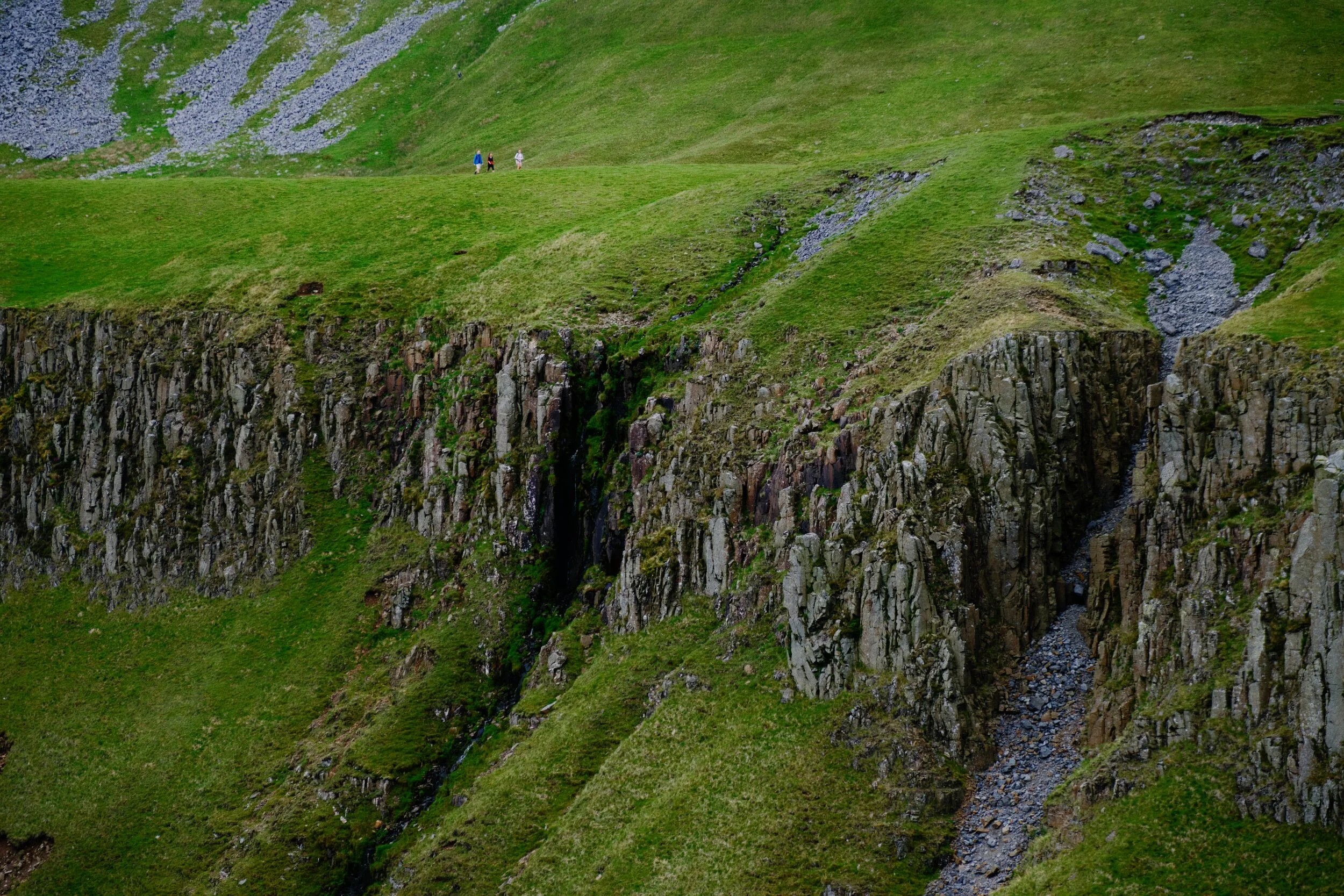 I wanted to show the scale of the Whin Sill cliffs and the precipitous drop in comparison to the tiny figures of people on the Pennine Way. 