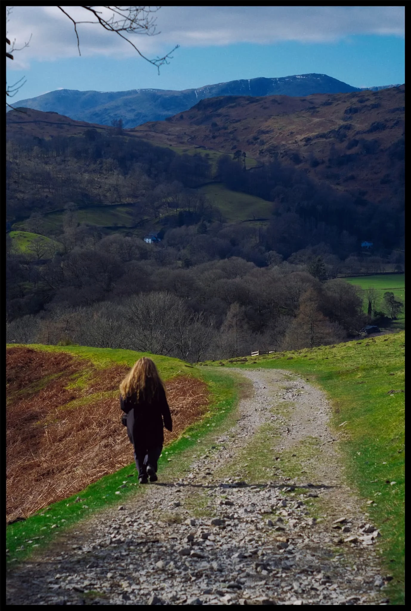  The long ridge of Wetherlam sinks beneath the bulk of Loughrigg as we descend. 