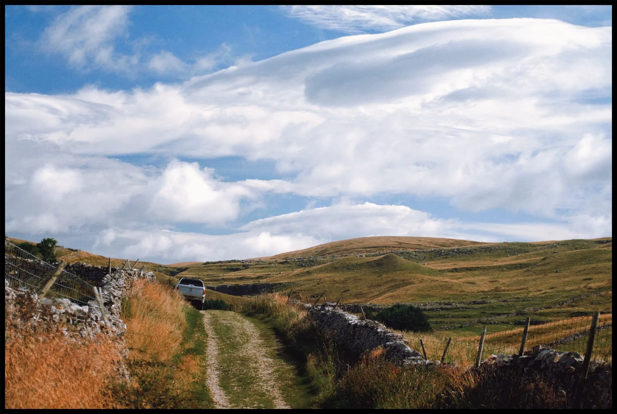  Painterly clouds like a mad genius&rsquo; brush strokes decorate the skies as we advance along the bridleway. 