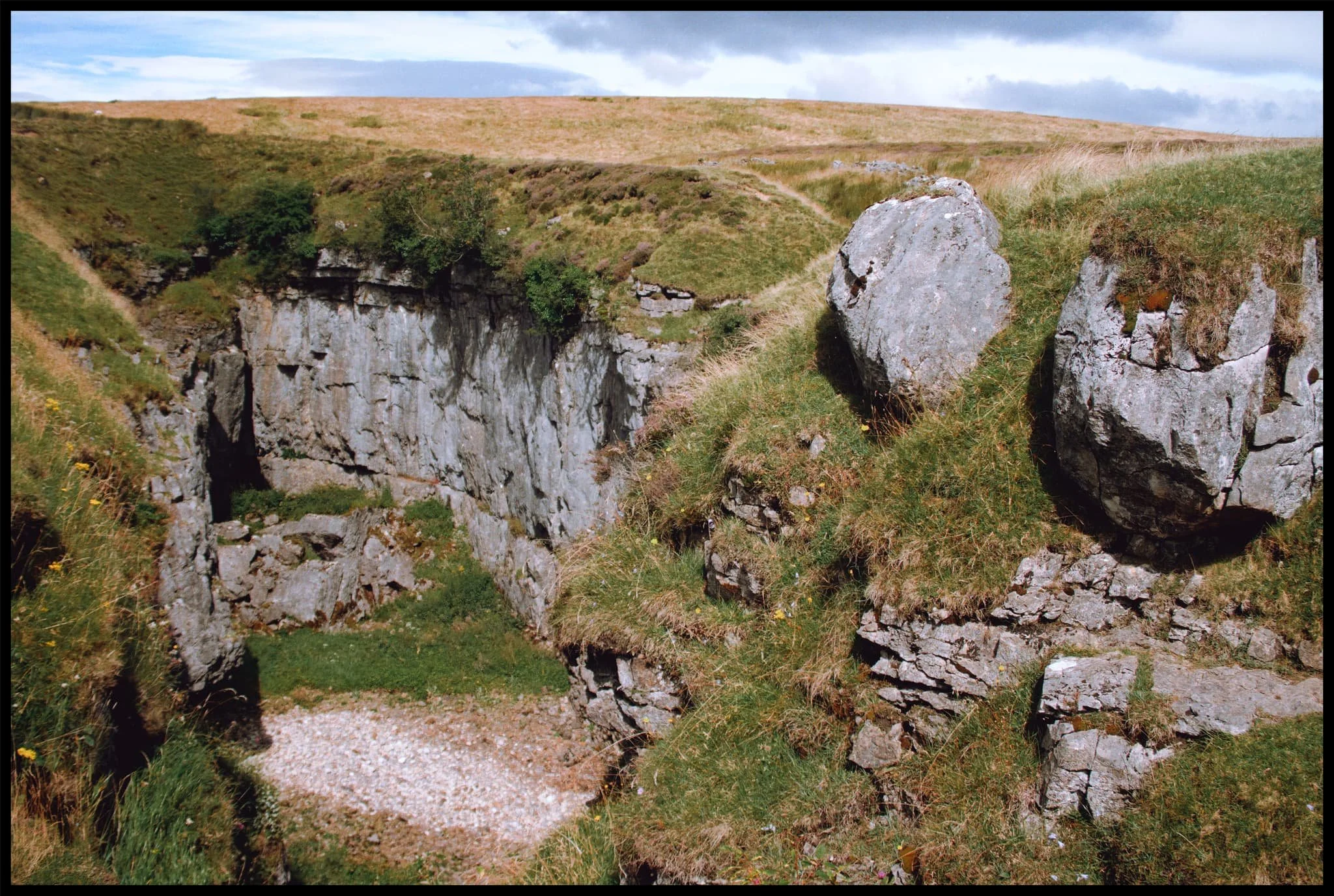  After a spot of lunch perched on the lip of Hull Pot&rsquo;s eastern end, I snap one last photo of the chasm before heading back. 