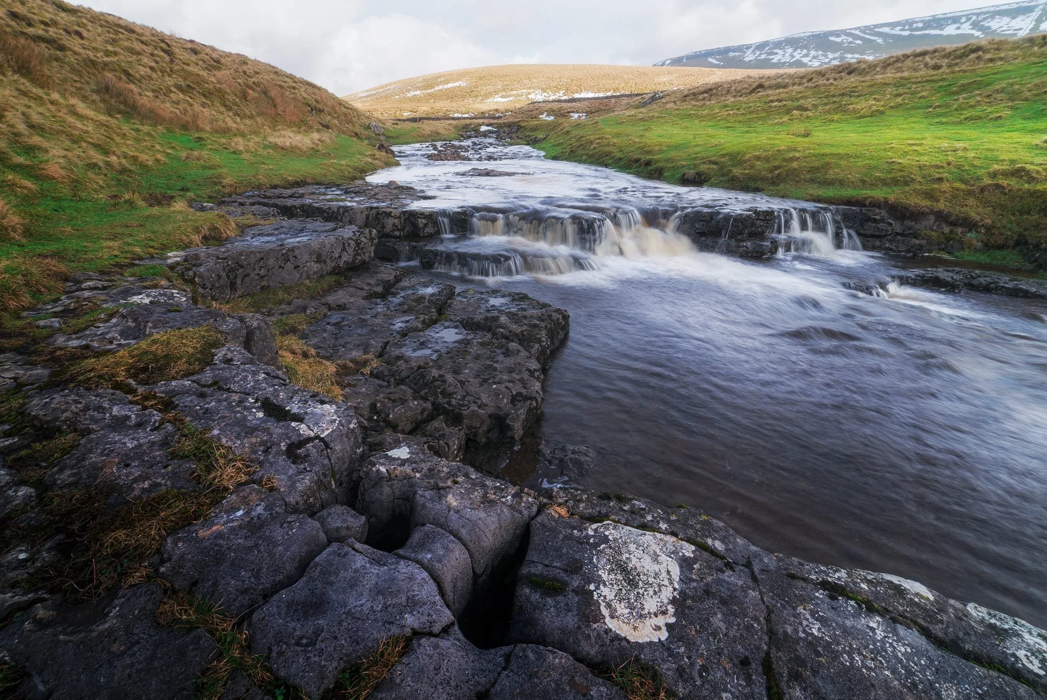  Looking up Hull Pot Beck and its many cascades. By the normal way of things, this beck is dry as it usually disappears into the maze of caves beneath Pen-y-Ghent before it reaches Hull Pot. With all the rain and snow we&rsquo;ve had, the beck was able to complete its route, crashing 60ft down into Hull Pot and re-emerging at the surface nearer Horton-in-Ribblesdale. 