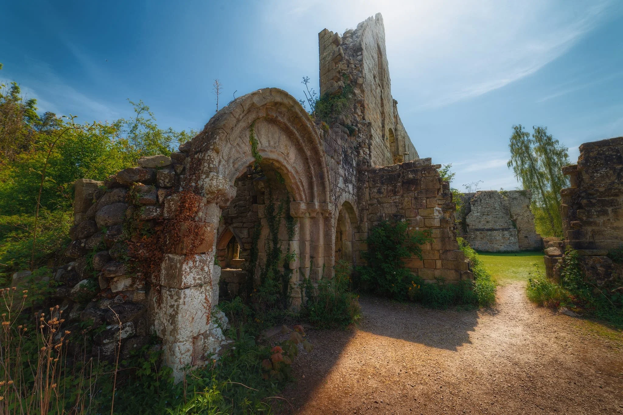  The tallest, most complete part of the ruins is one of the walls of the Cloister. This would&rsquo;ve been the central element of monastic life. Monks used the cloister for reading, writing, and quiet contemplation. The design allowed natural light to enter, making it an ideal space for manuscript work and study. It also served as a place for communal activities and was integral to the daily routines of monastic life. 