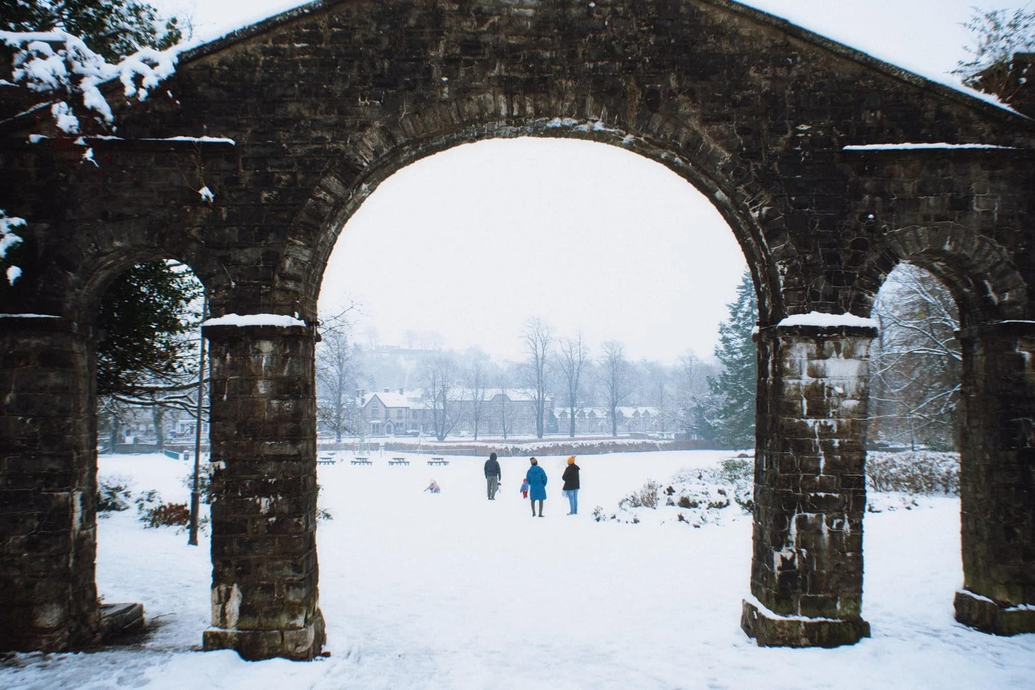  Families were out in full, making snowmen, throwing snowballs, and sledding on hills. 