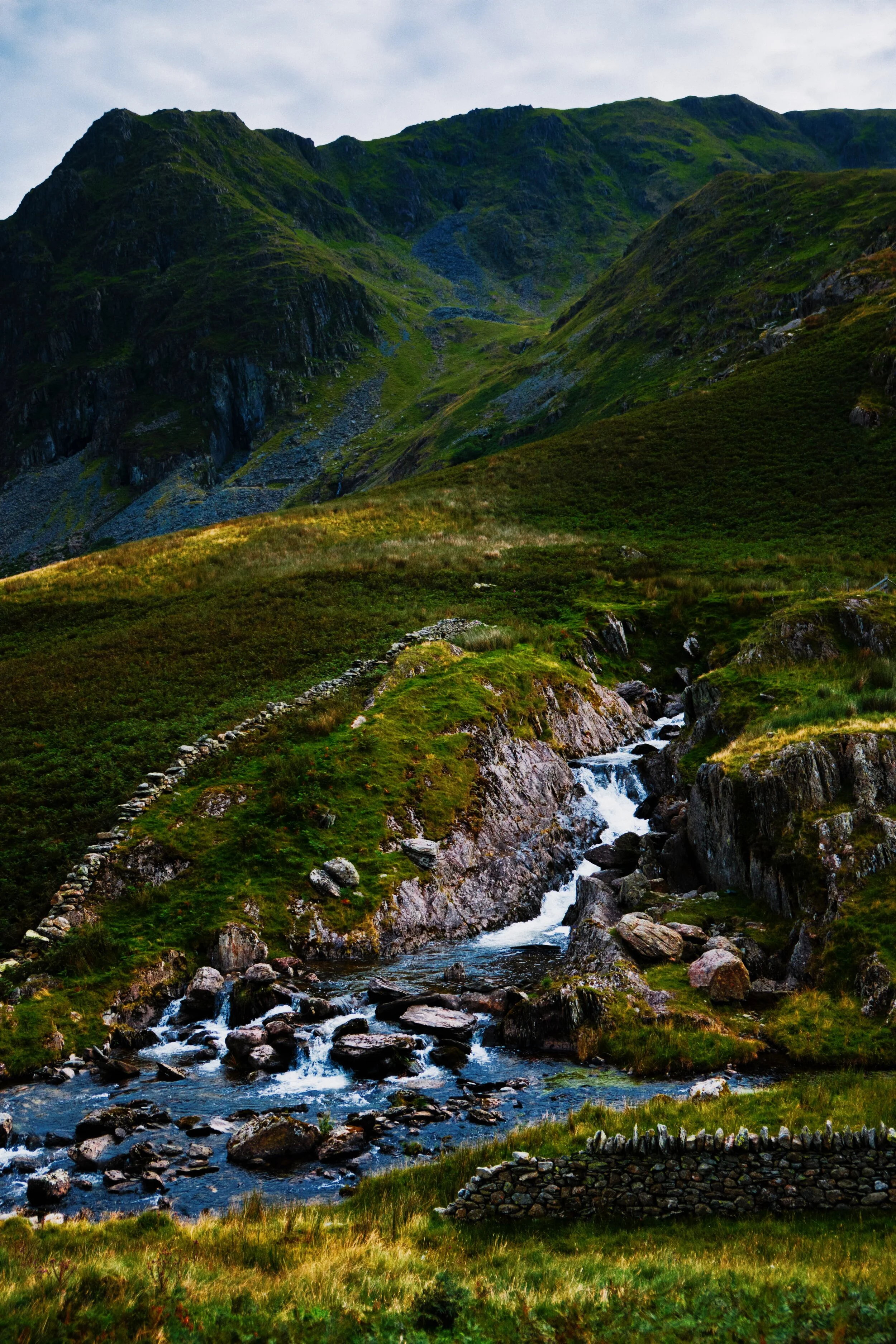 The falls pouring from the outlet at Kentmere Reservoir, and looking up at Rainsborrow Cove.