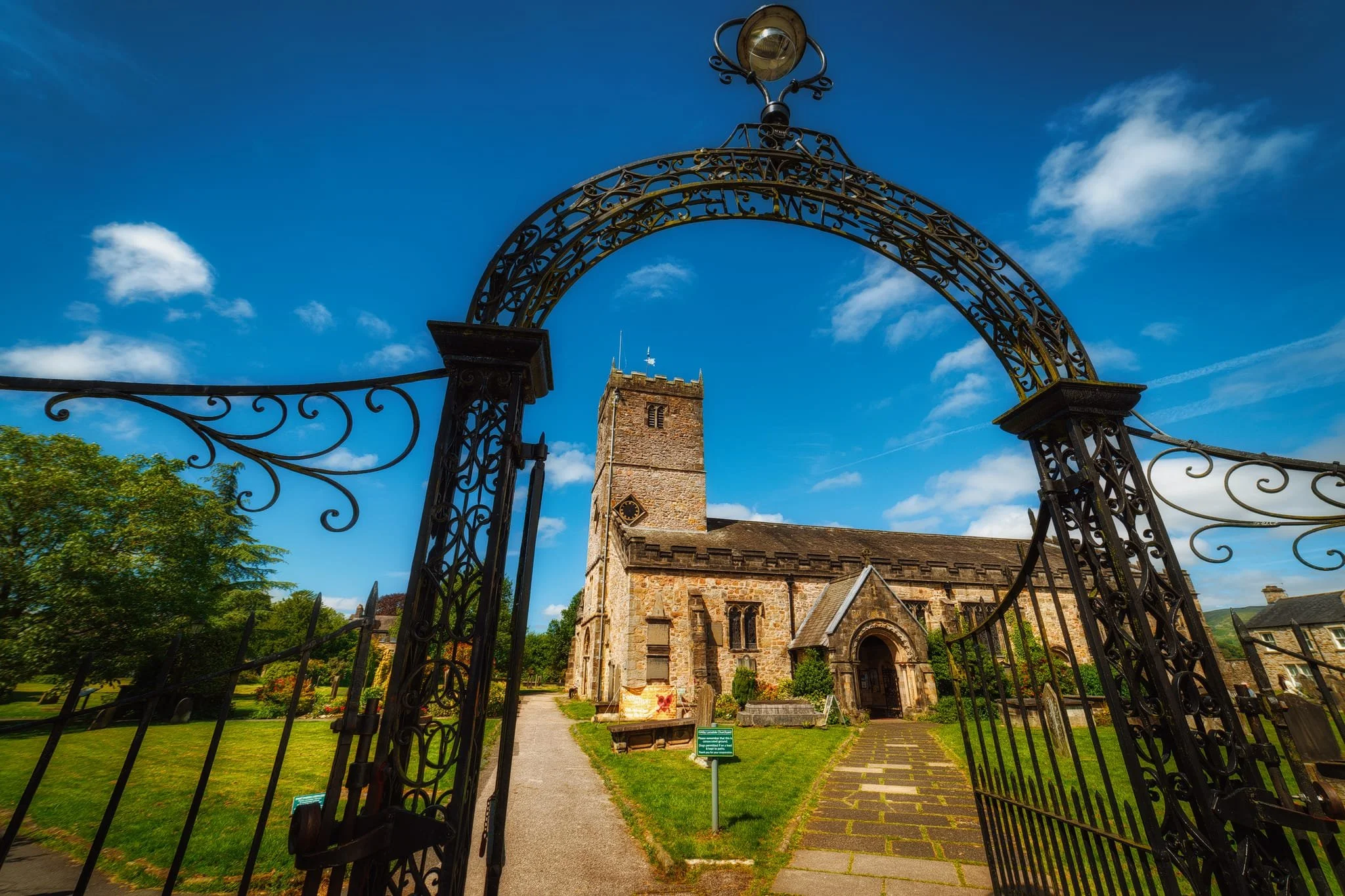  Up and beyond the Radical Steps, I equip my 14mm ultra-wide lens and frame this composition of St. Mary&rsquo;s Church using the old gateway. Parts of the church date from Norman times. 