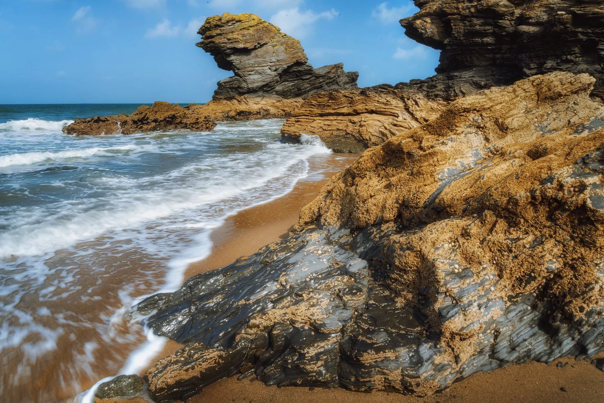  The sea stack is the well-known  Carreg Bica , found under the northern cliffs of Llangrannog. A popular story claims  Carreg Bica  is actually the tooth of a giant named Bica who once resided in the Ceredigion region. The tale suggests Bica suffered from a terrible toothache, ultimately forcing him to spit the offending tooth onto the beach where it remains to this day.     