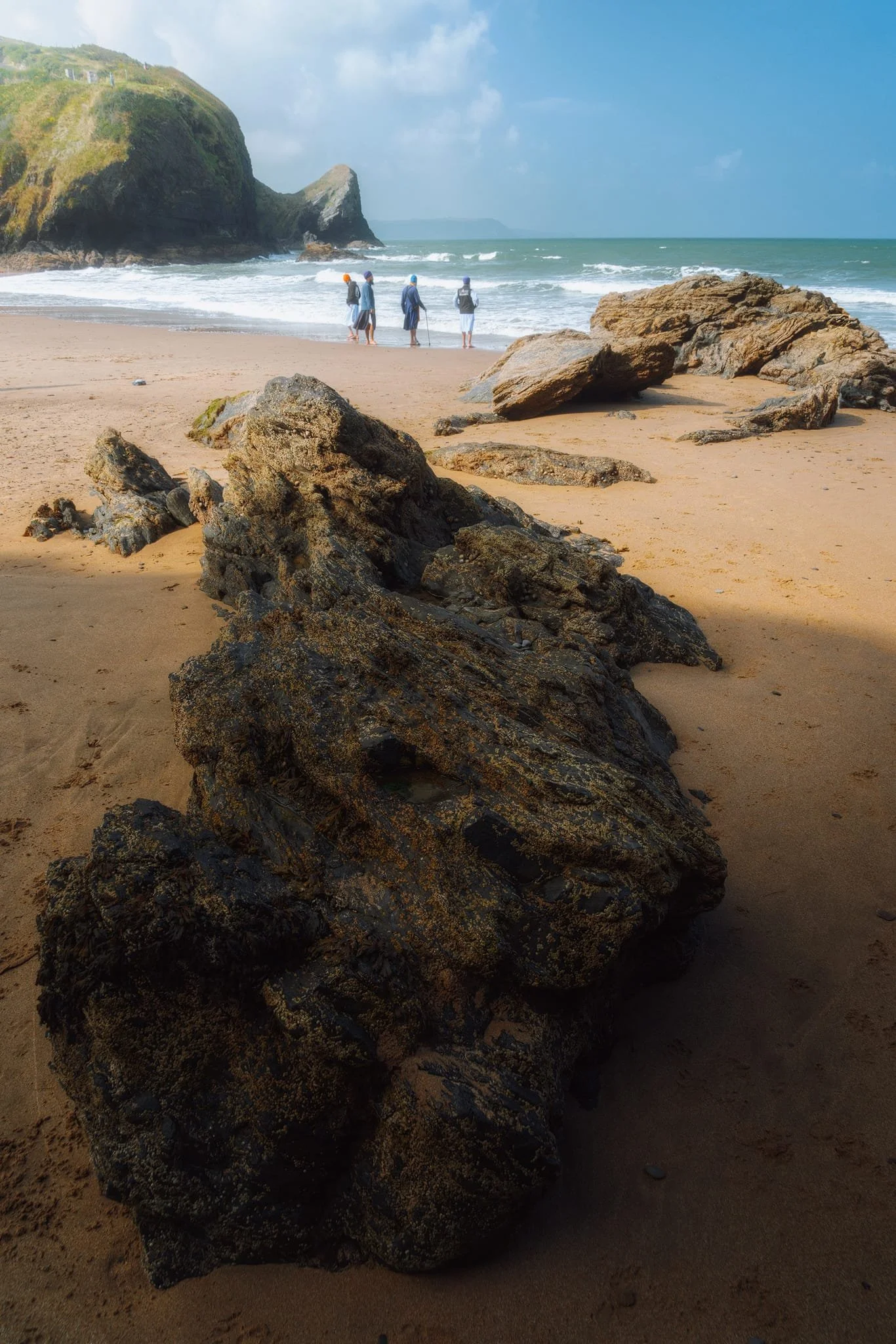  I line up a series of beach boulders and outcrops in this composition towards  Pen-rhip  again. Also included: A group of Sikh gentlemen enjoying the sea and the scenes. 