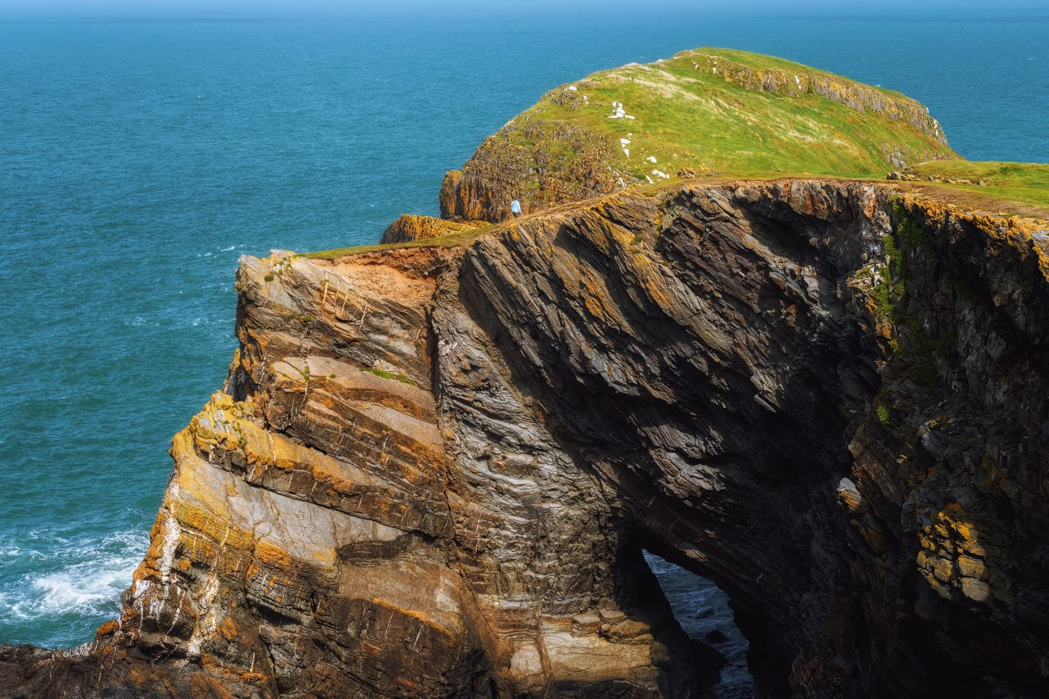  Zooming in long with my 24-240mm allows me to focus on the natural arch and geological unconformities.  