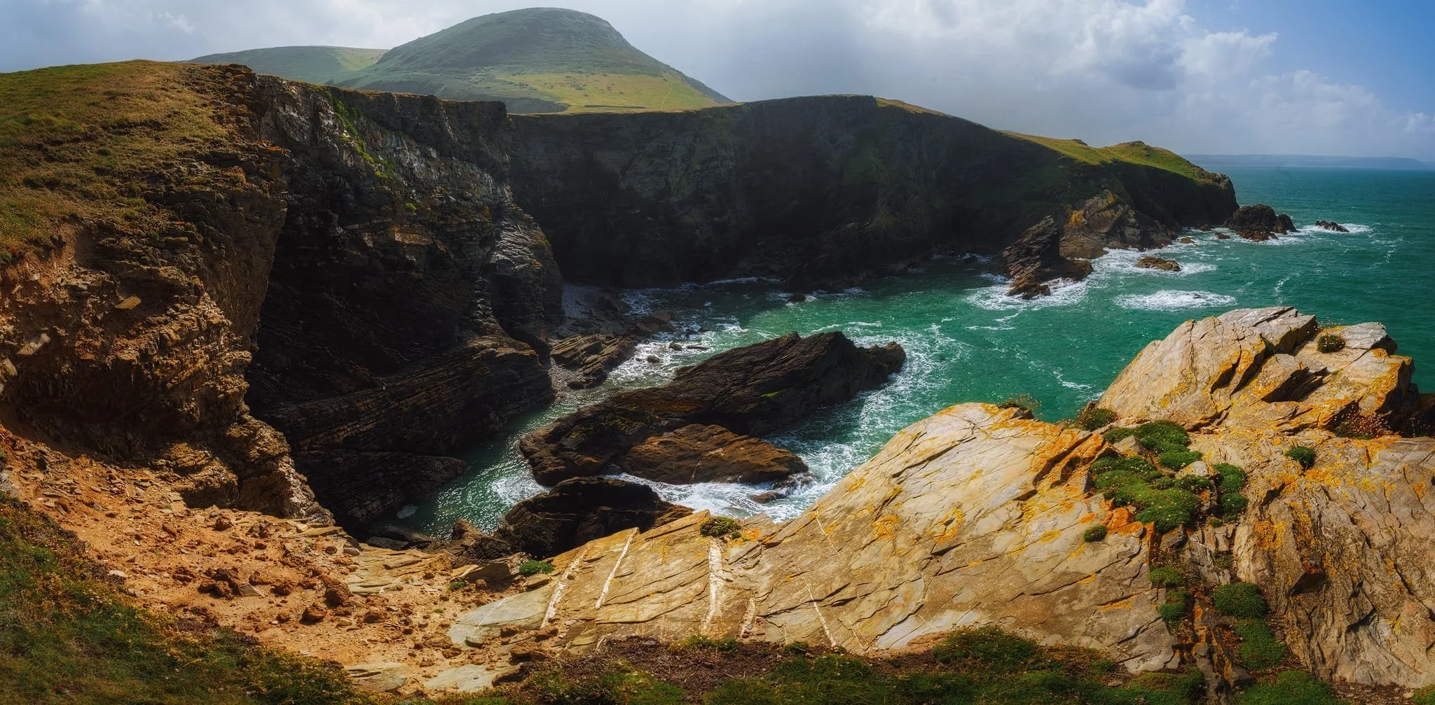  Looking back at  Pendinaslochdyn  and the cliffs from the northern tip of the peninsula. This is five vertical 14mm exposures, shot left to right, later stitched together into this massive panorama.  