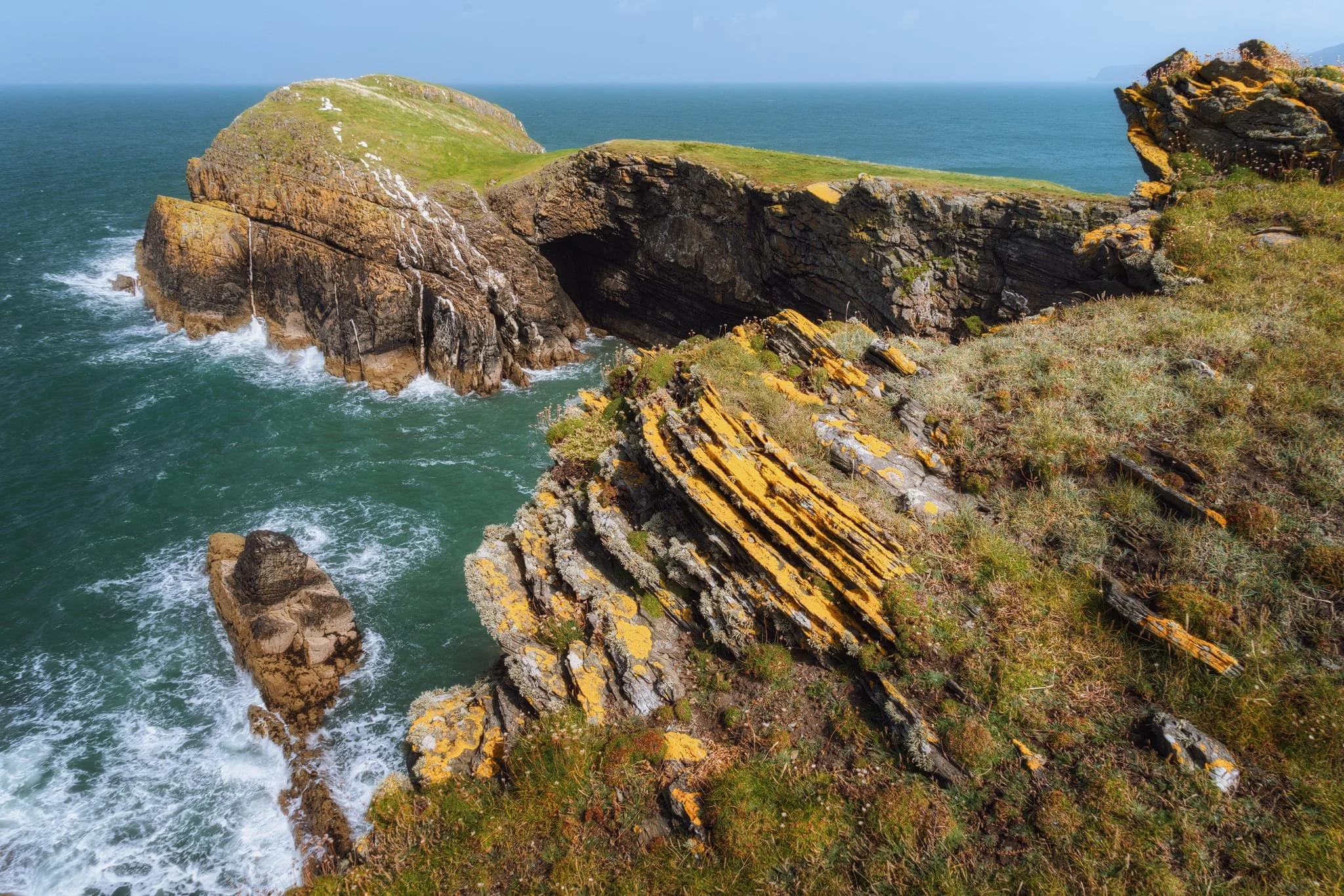 Heading clockwise from the northernmost point of the  Ynys Lochtyn  peninsula, a full view of the tidal island that gives its name to the peninsula comes into view. Access to this tidal island is possible only at the lowest of tides. I&rsquo;m still not sure that white streak in the headland is guano or some sort of geological intrusion of a different type of rock. 