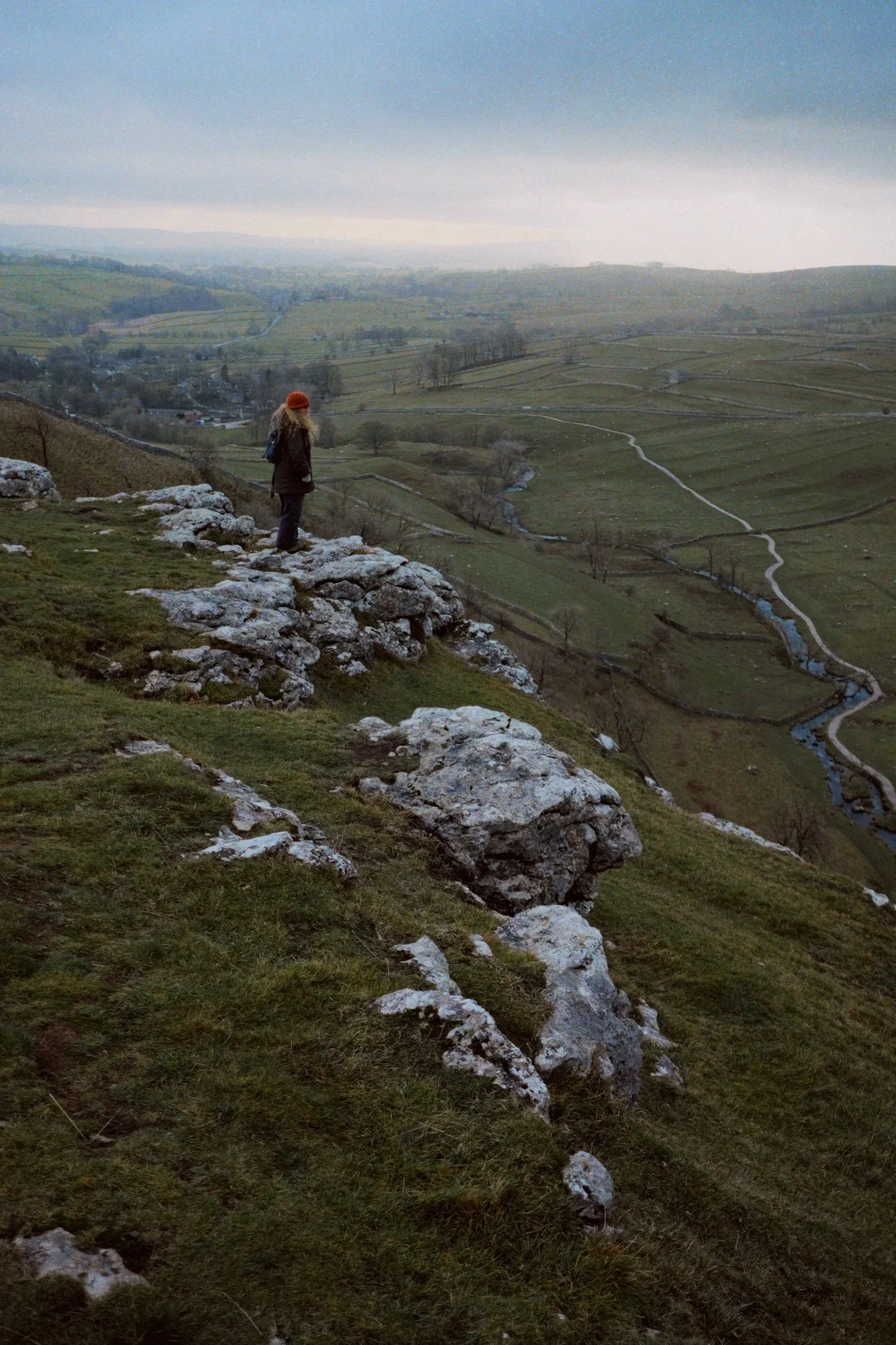 My lovely Lisabet being unusually daring near the edge of Malham Cove’s eastern shoulder. That’s quite a drop, honey…