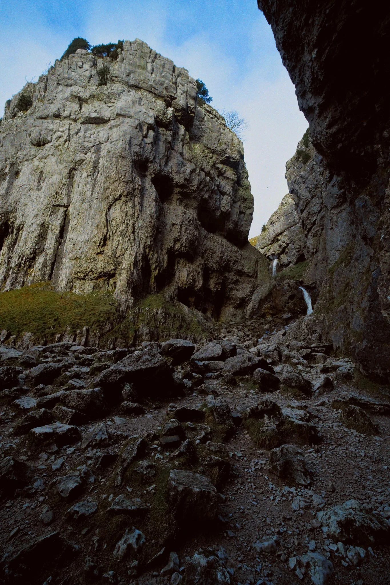 The towering crags of limestone, catching the afternoon winter sun above the waterfalls.