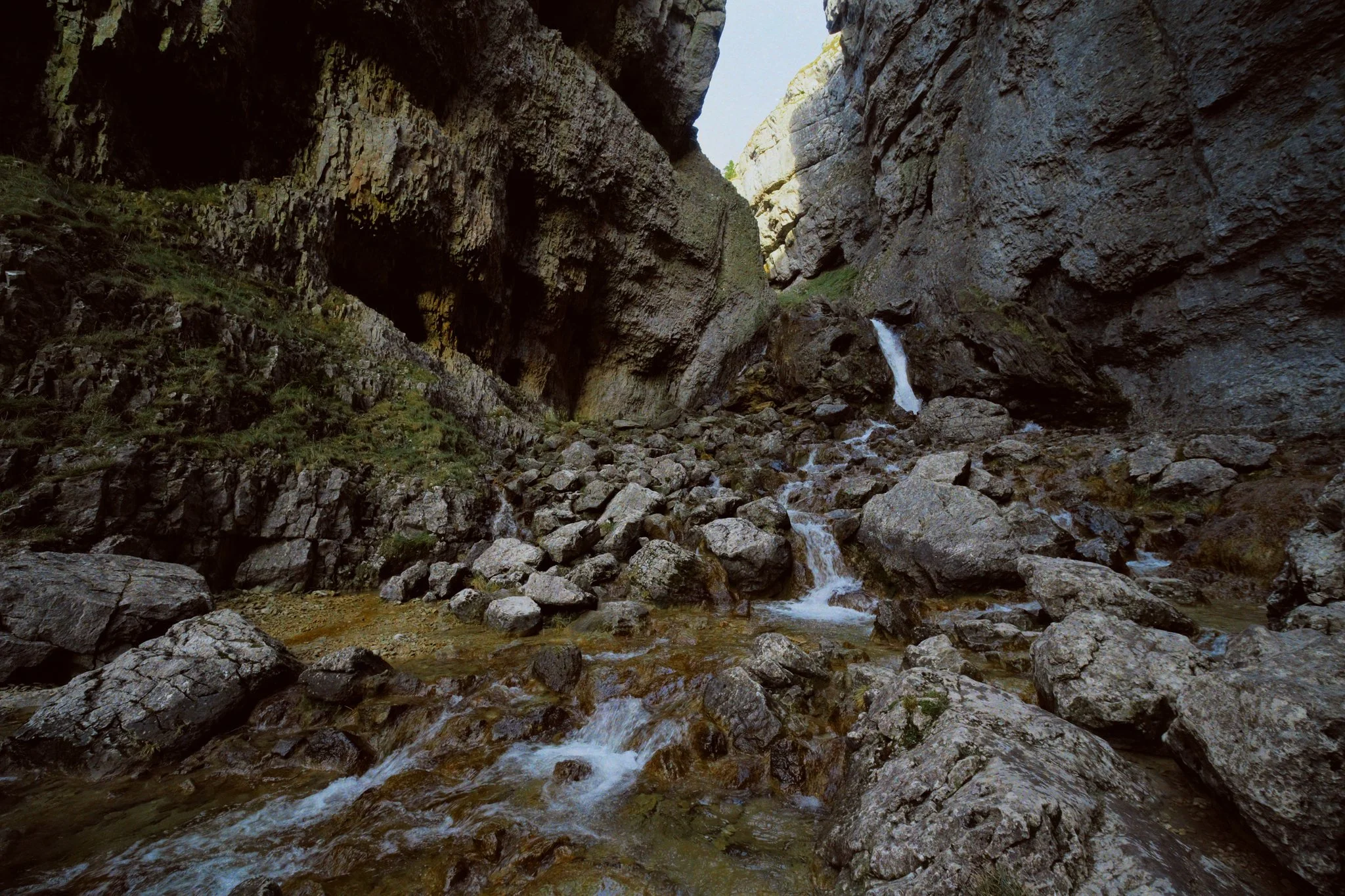 Mud-slicked limestone made clambering around the boulders in the gorge treacherous, so this was as close as I could get to the waterfalls.