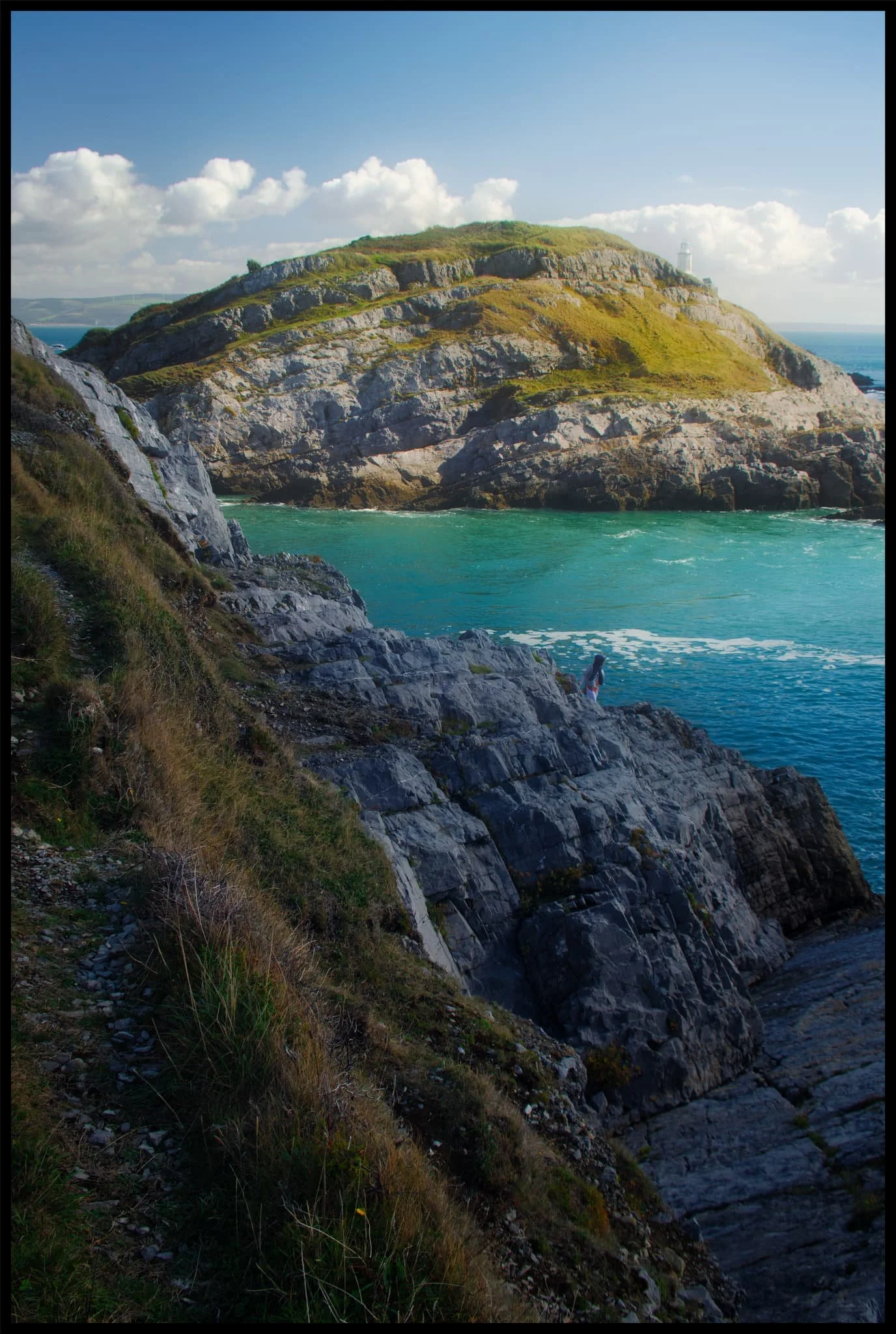  An alternative composition as we climbed further up Mumbles Head, with Middle Head attracting the full attention of the sun from behind the clouds. 