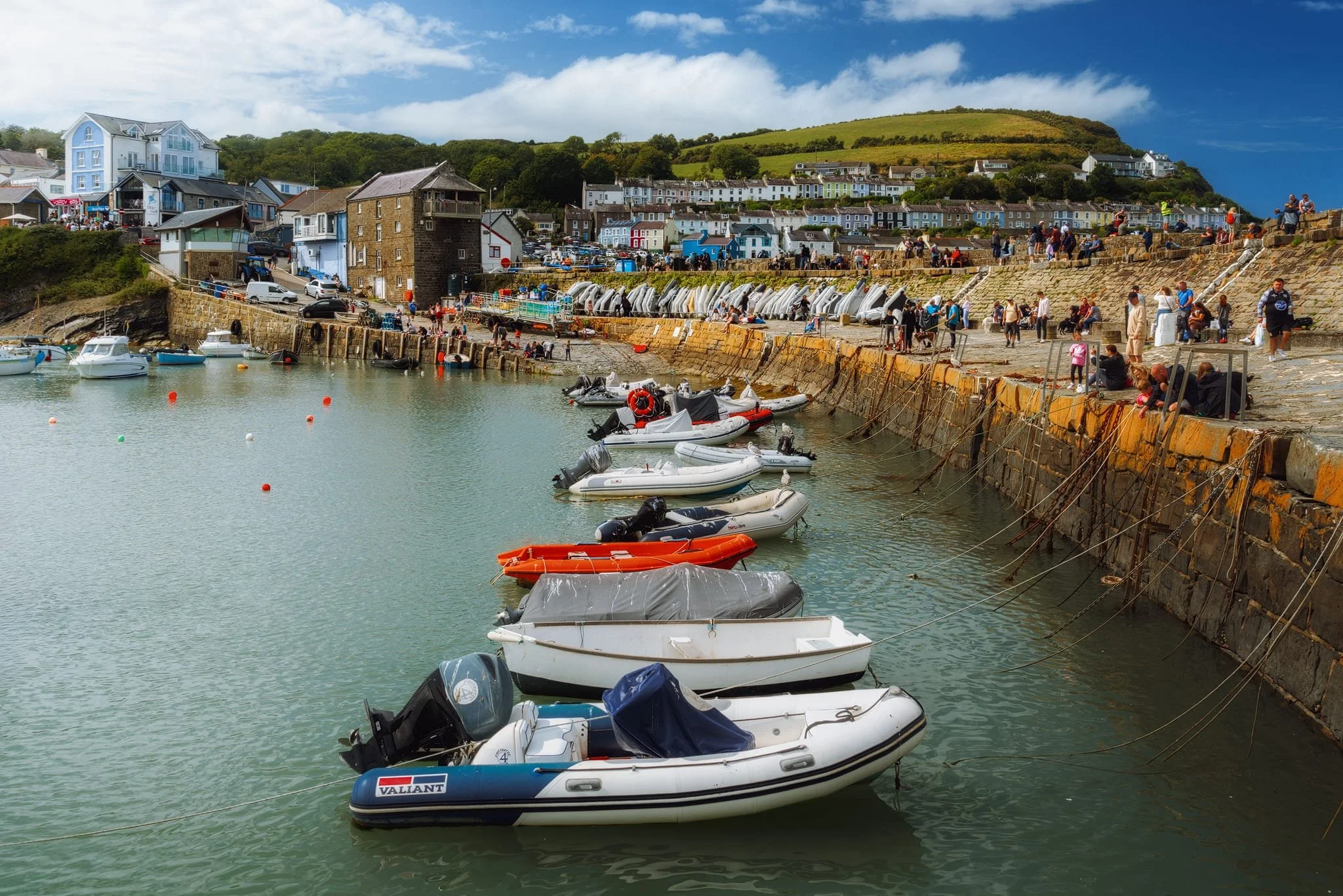  Lisabet and I paid for a small boat trip around the waters of Cardigan Bay from New Quay, courtesy of   SeaMôr Dolphin Watching  . While we were waiting at the old stone pier, I captured this scene of New Quay in its full summery touristy glory. 
