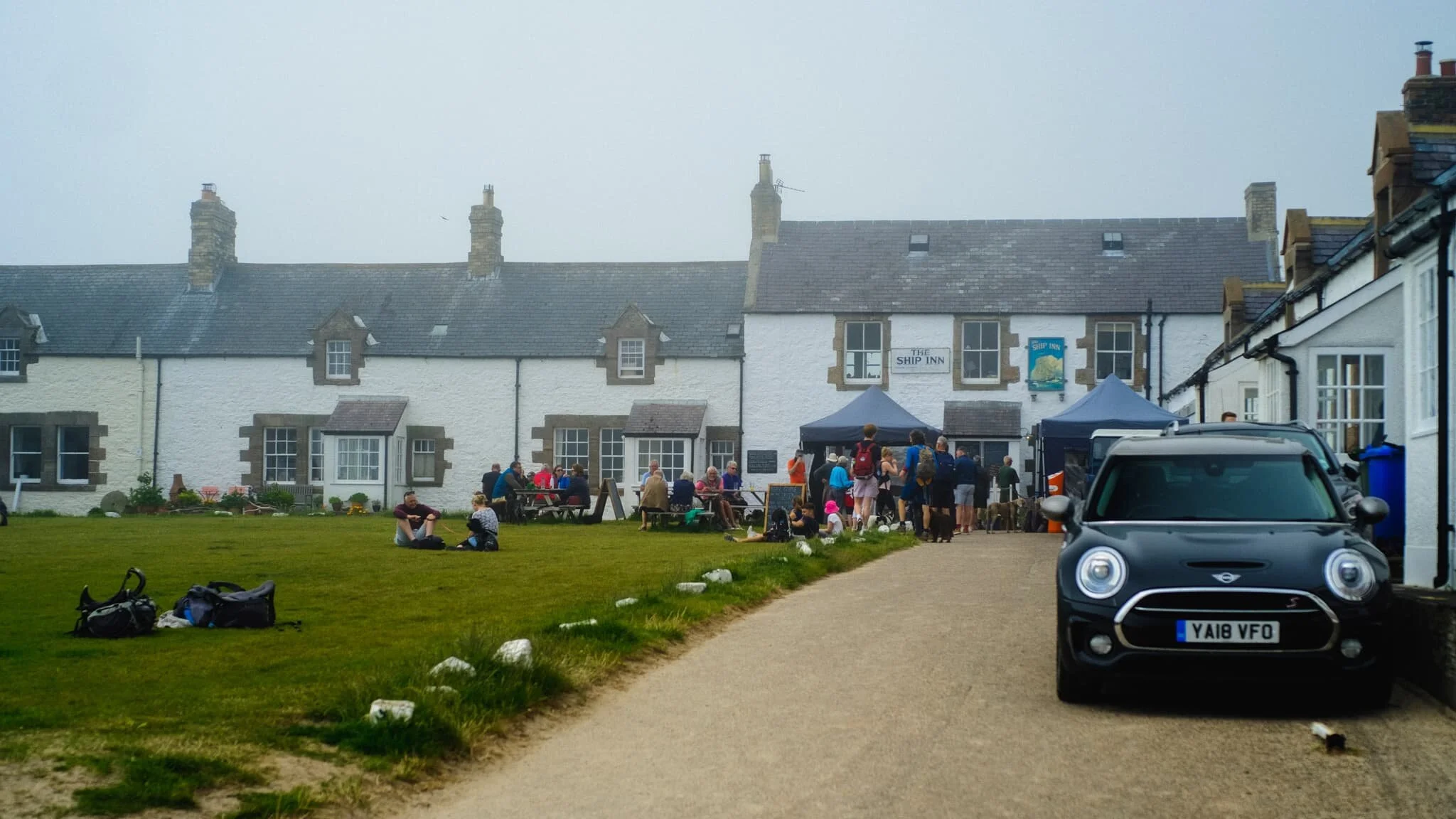 The village is known for its cream white cottages and open square, with the 18th-century Ship Inn pub right in the middle. A charming place.
