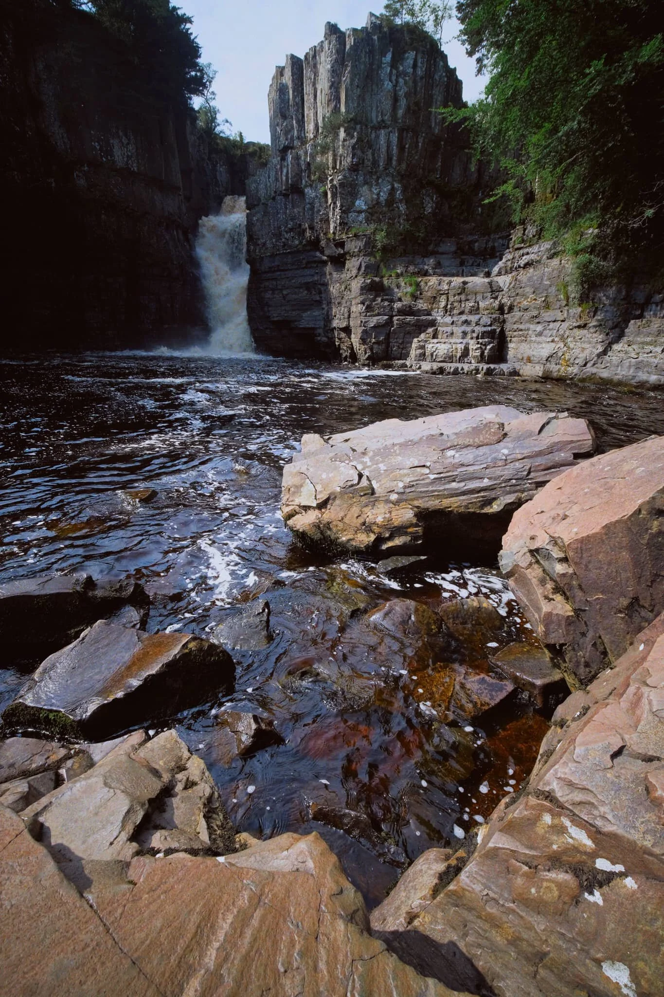 We scrambled down to the boulder field left behind by the receding waterfall, each of us seeking our own photographic compositions of the waterfall.