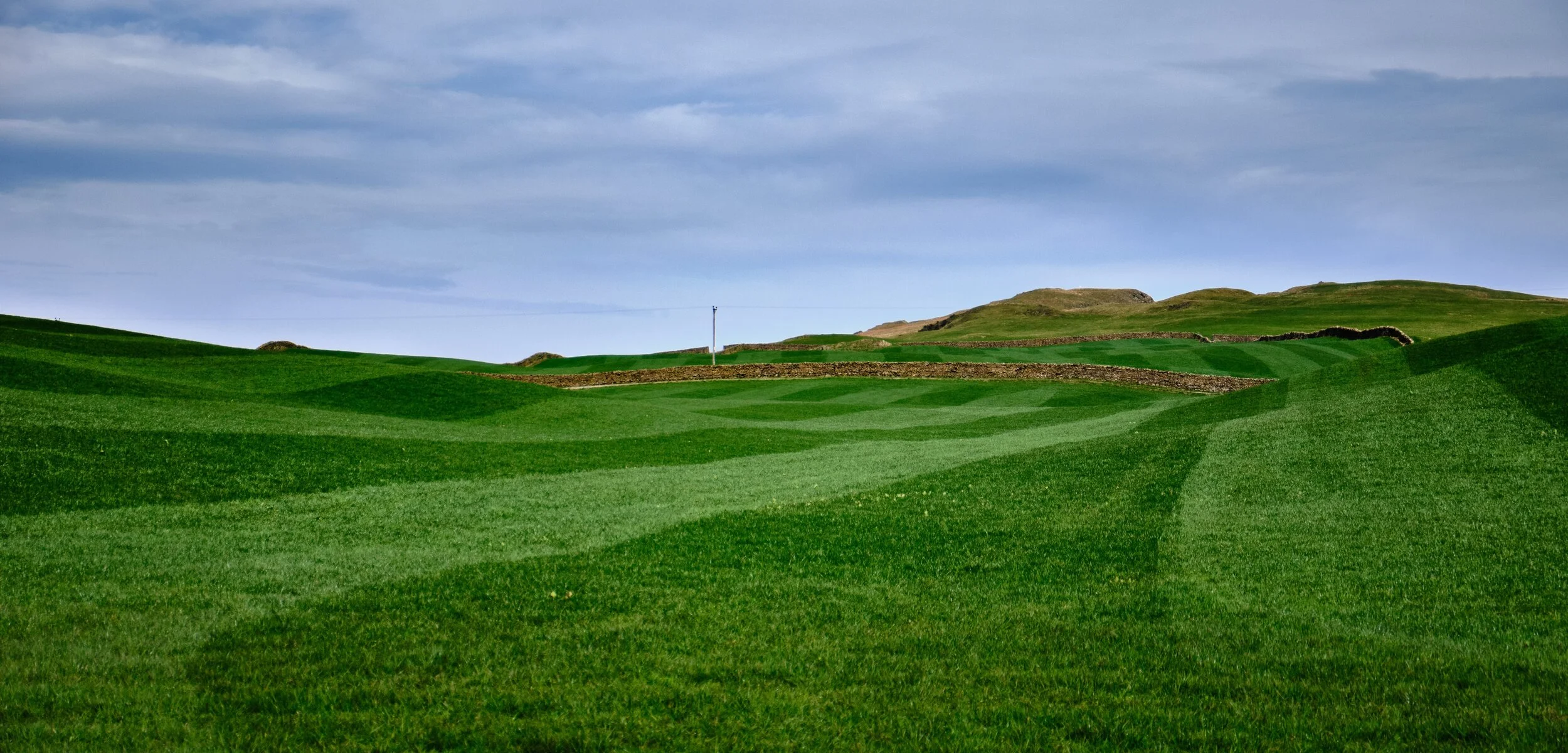 Lovely lines created by the freshly mown grass and the contours of the land.