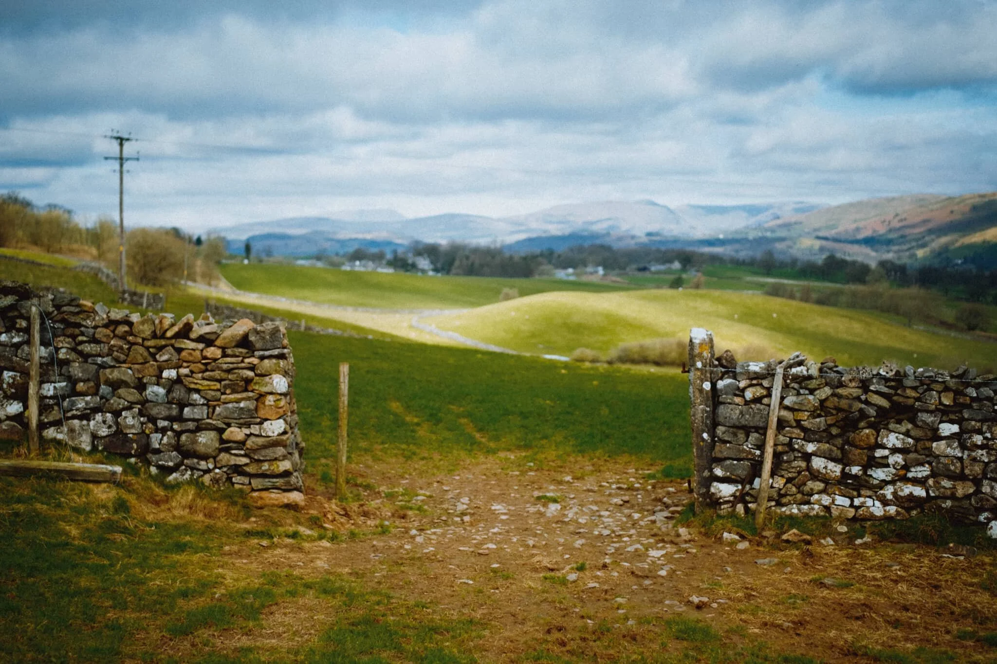 Just before we reached the track directly underneath Helsfell Nab, I stopped for this quick shot as I noticed the sun scanning light across the rolling fields above Kendal.