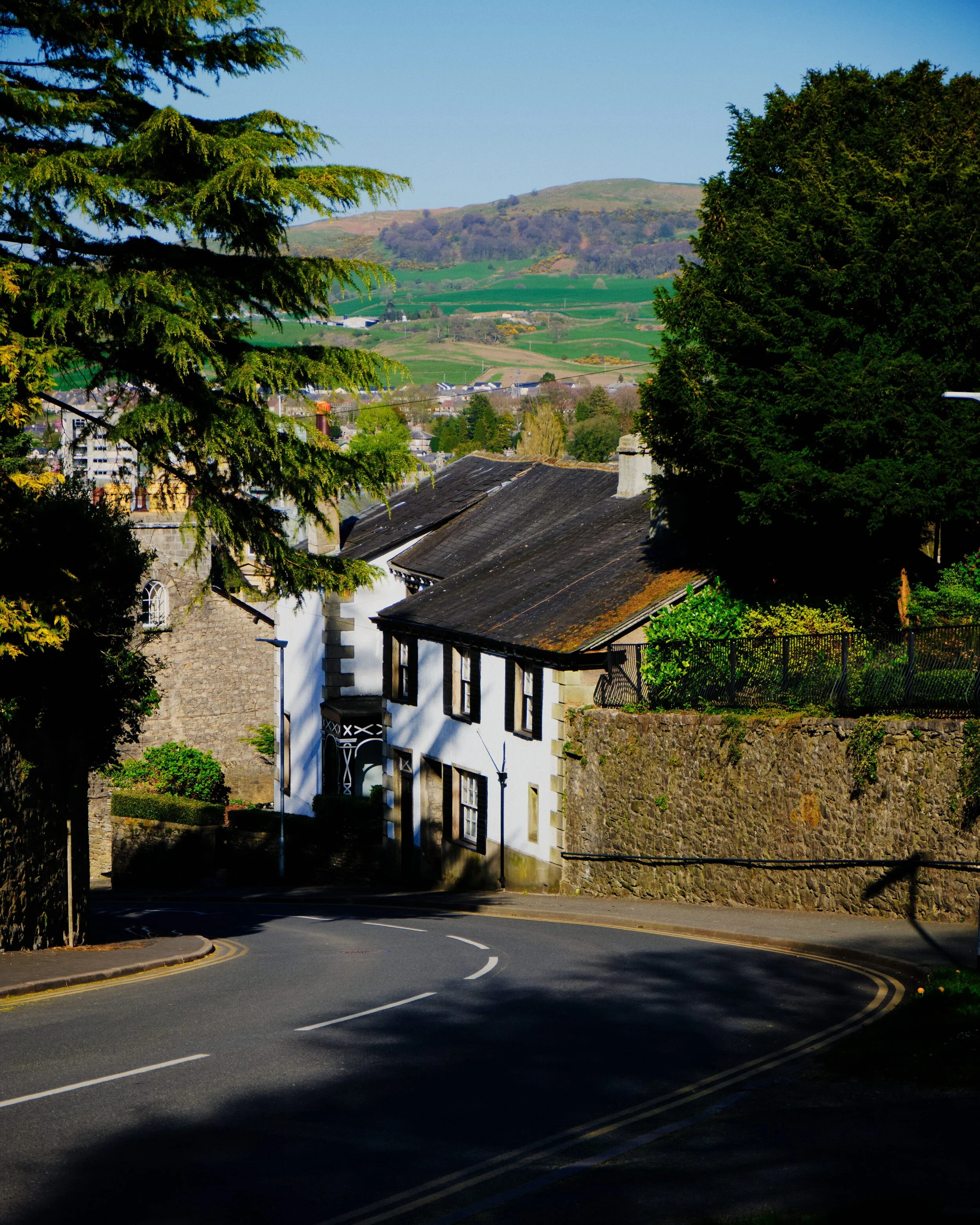 Heading back down to Kendal town centre via Beast Banks, one of the steepest roads in Kendal. In the distance rises Benson Knott.