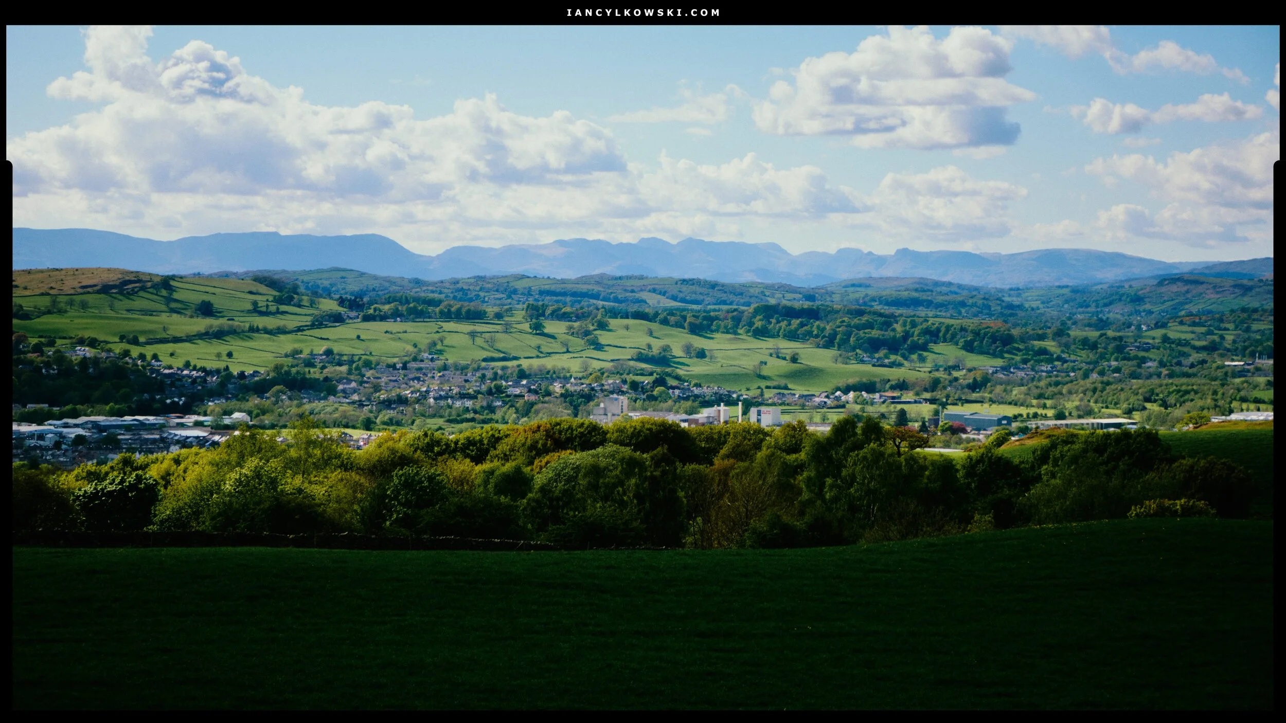  These are the sort of expansive views you get from Paddy&rsquo;s Lane: Kendal nesting in its valley and the craggy profile of the Lake District fells beyond. 